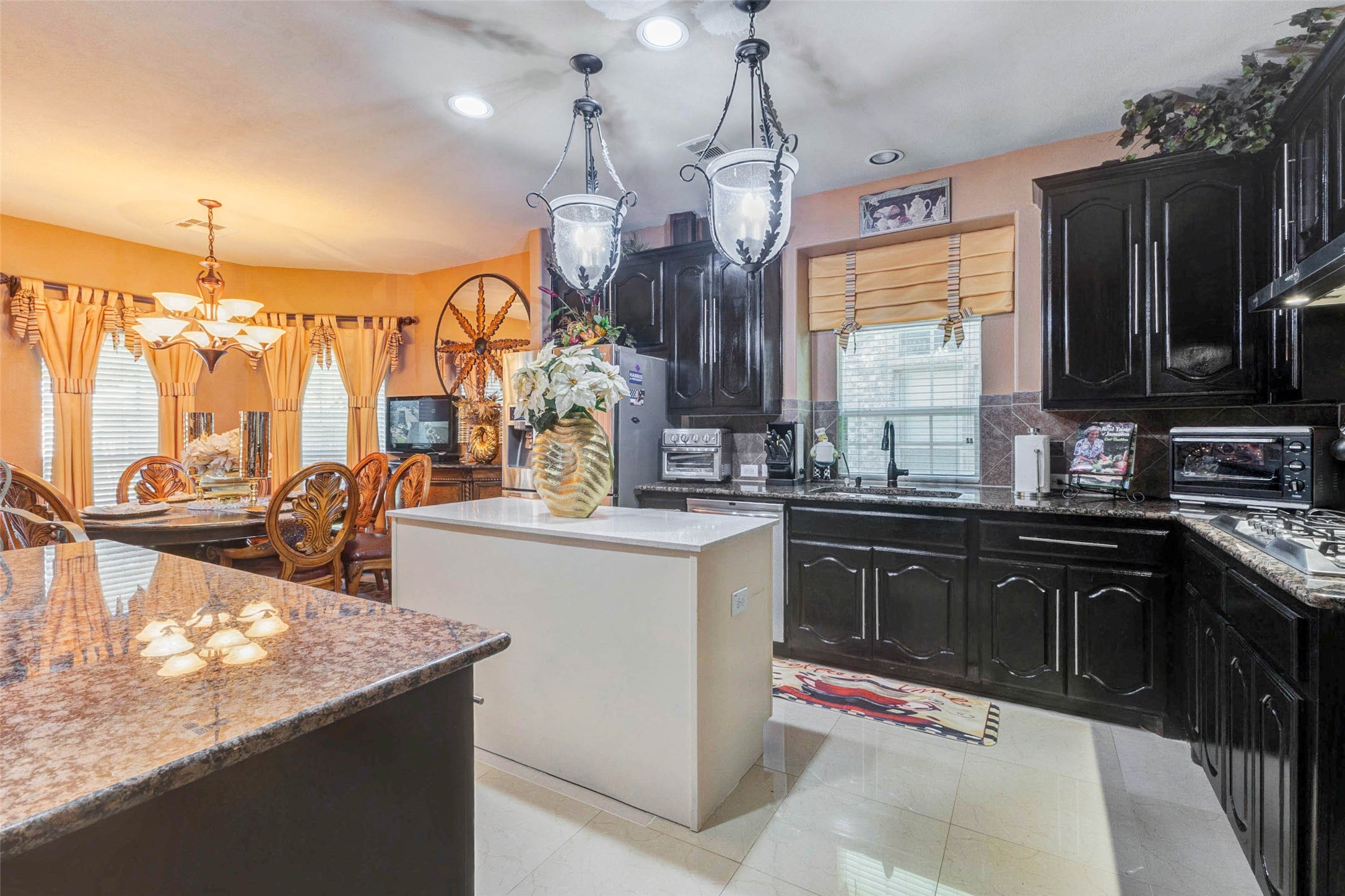 8211 Paddle Rock Lane Rosenberg, TX 77469 - Photo 13 of 50 a kitchen with stainless steel appliances granite countertop a sink counter space and a window