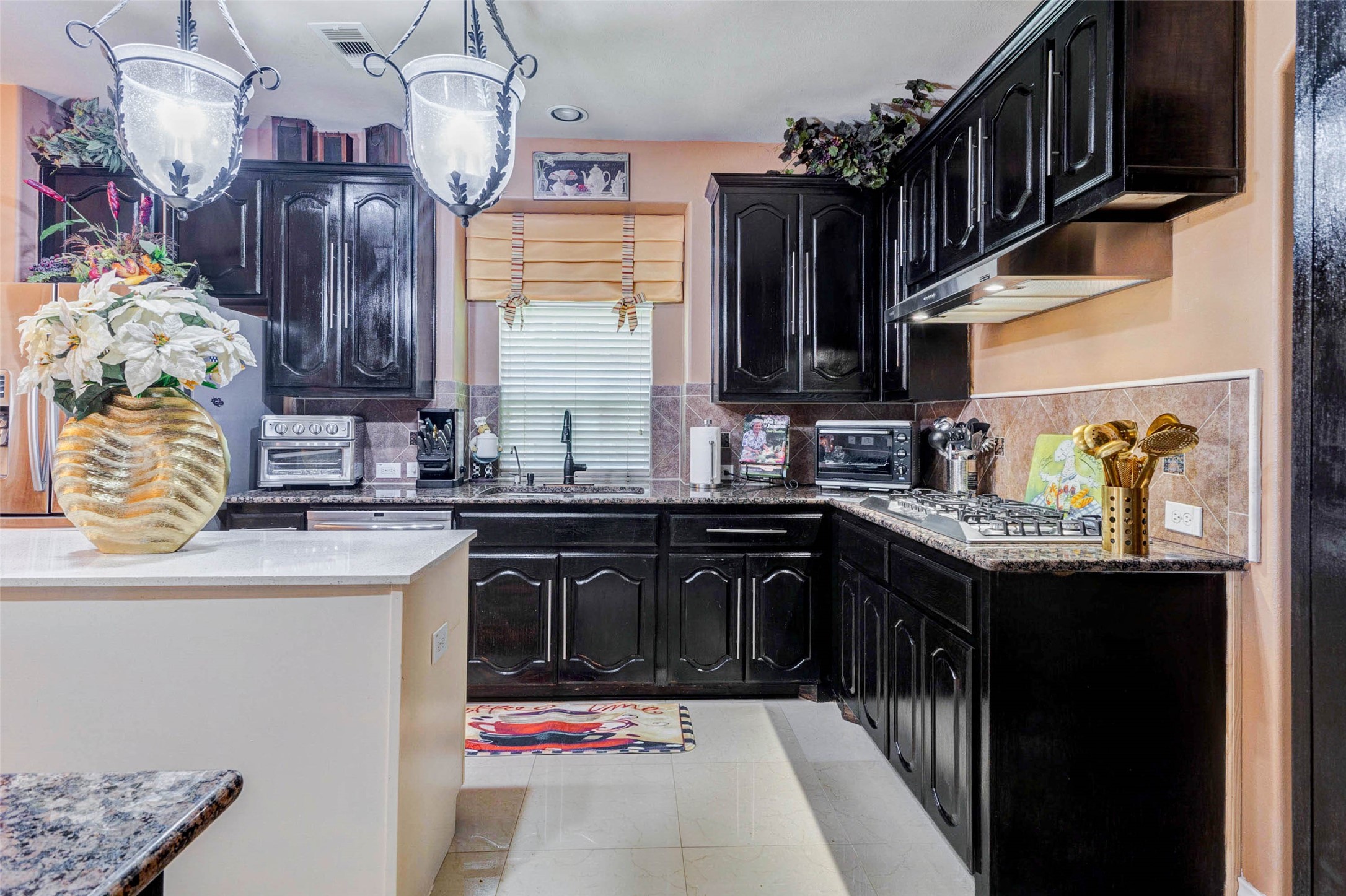 8211 Paddle Rock Lane Rosenberg, TX 77469 - Photo 14 of 50 a kitchen with stainless steel appliances granite countertop a sink stove and cabinets
