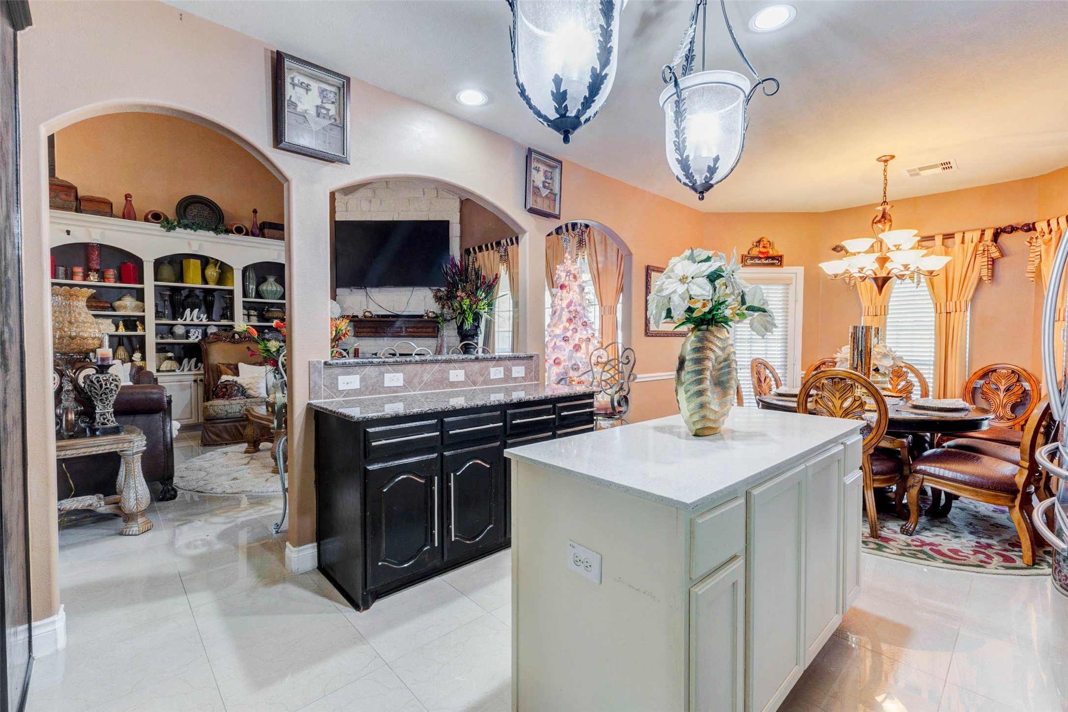 8211 Paddle Rock Lane Rosenberg, TX 77469 - Photo 15 of 50 a kitchen with a stove oven and a view of living room