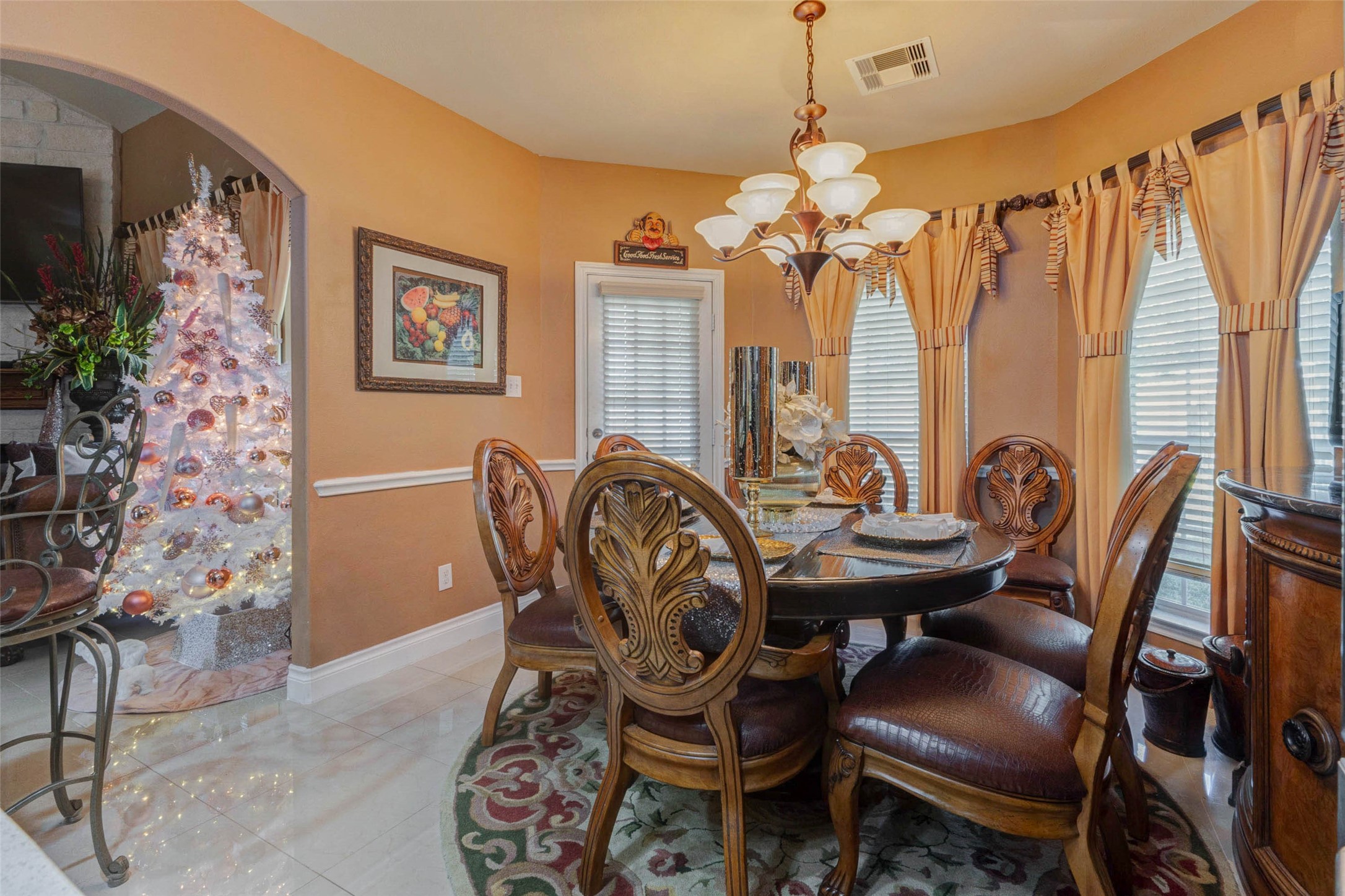 8211 Paddle Rock Lane Rosenberg, TX 77469 - Photo 18 of 50 a view of a dining room with furniture window and wooden floor