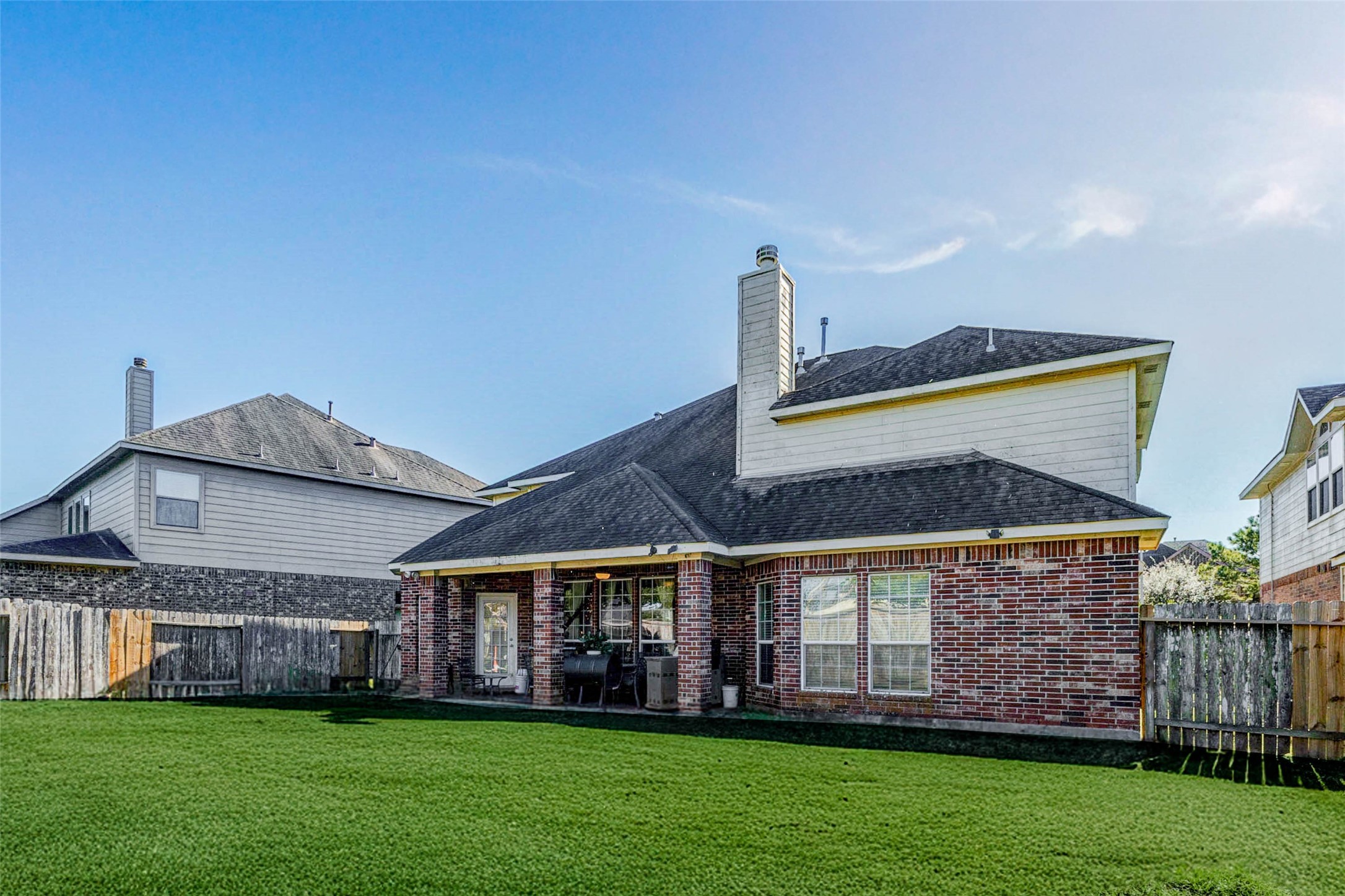 8211 Paddle Rock Lane Rosenberg, TX 77469 - Photo 2 of 50 a front view of a house with a garden