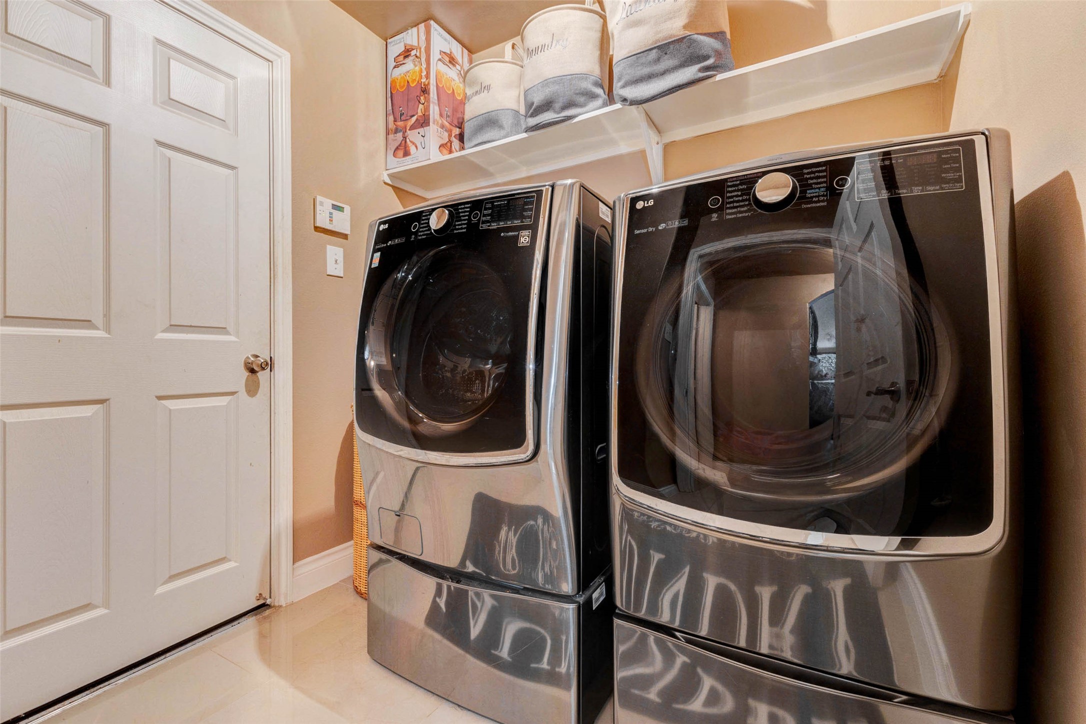 8211 Paddle Rock Lane Rosenberg, TX 77469 - Photo 24 of 50 a utility room with dryer and washer