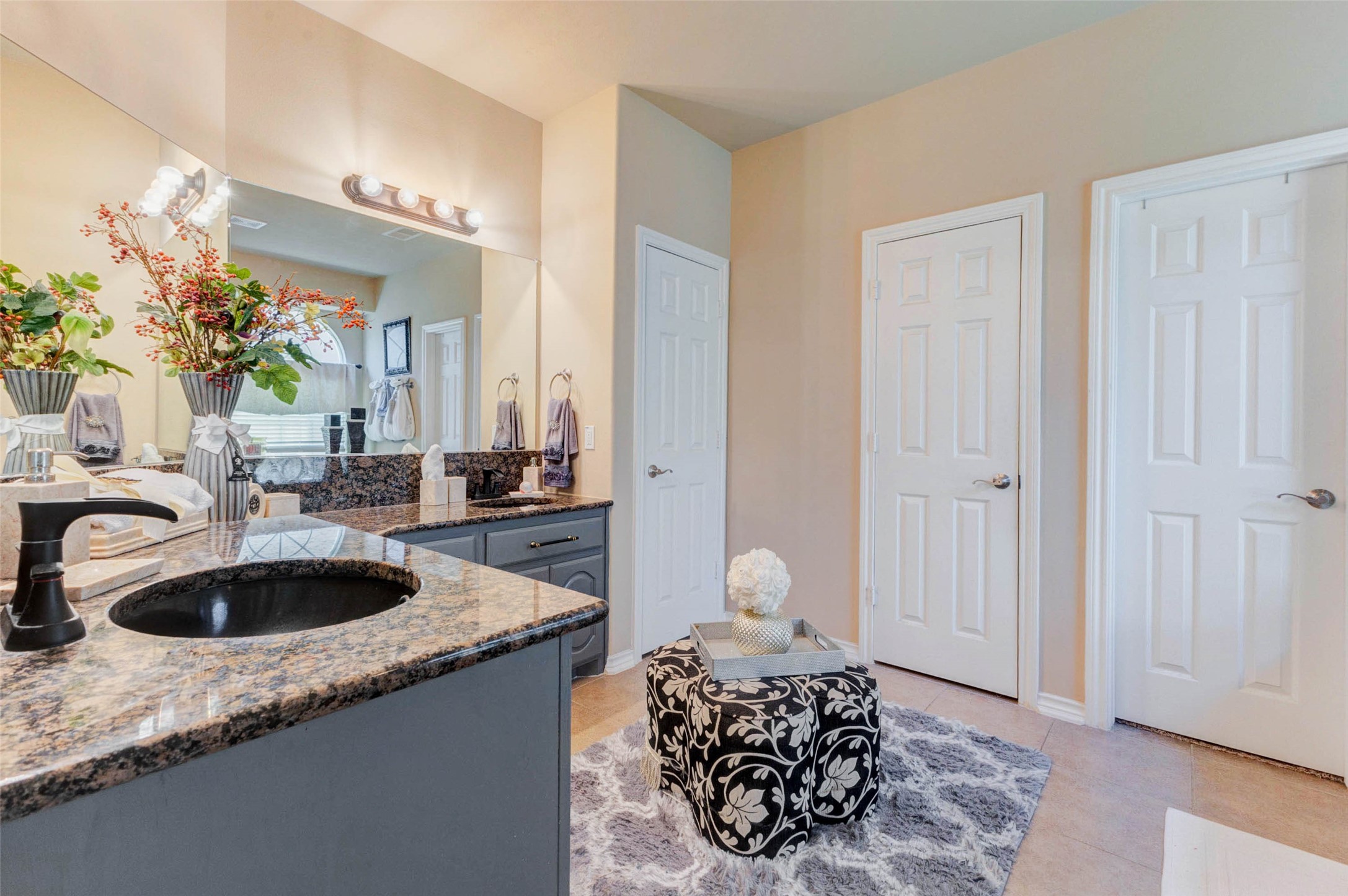 8211 Paddle Rock Lane Rosenberg, TX 77469 - Photo 29 of 50 a bathroom with a granite countertop sink and a mirror