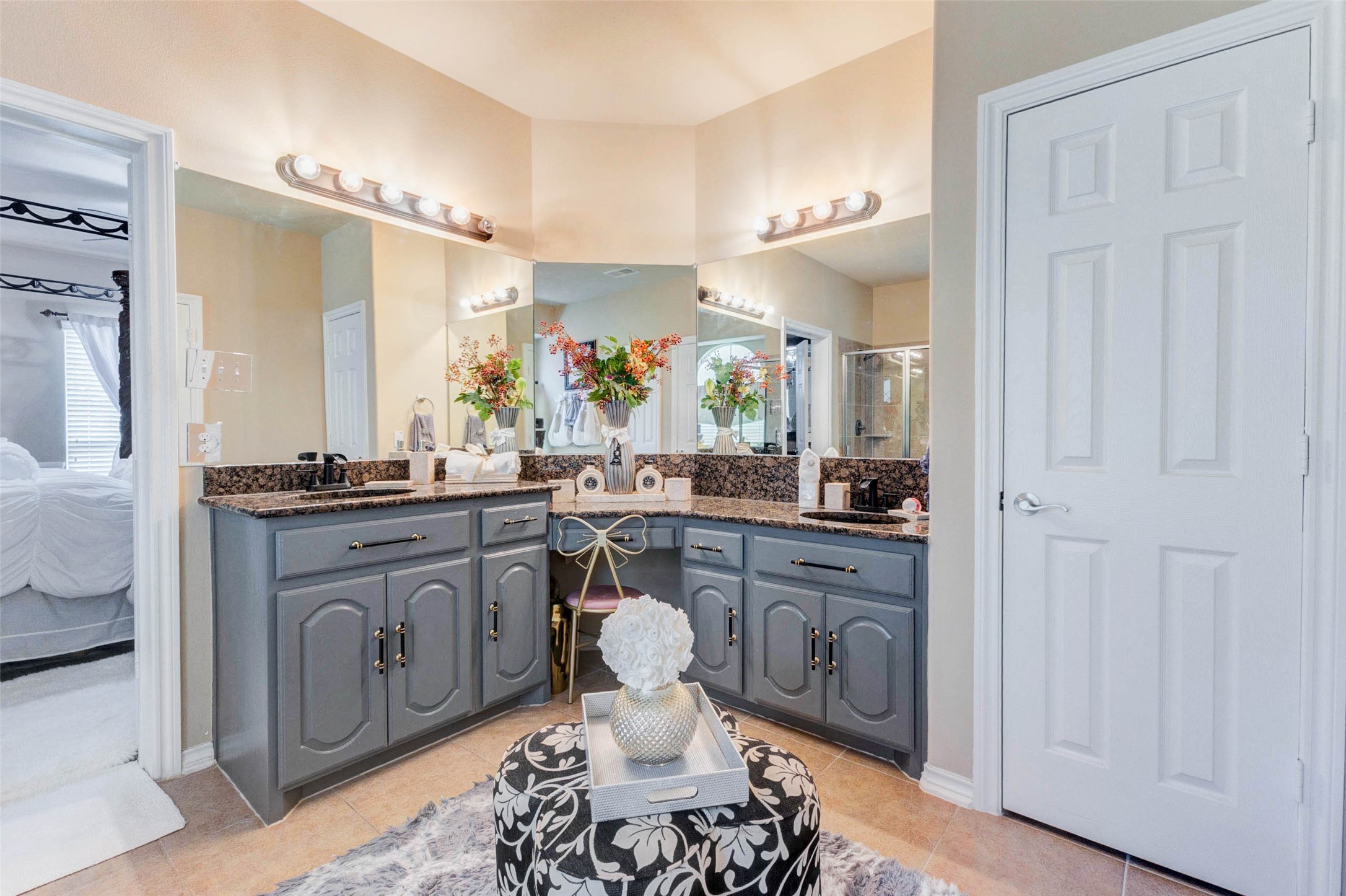 8211 Paddle Rock Lane Rosenberg, TX 77469 - Photo 30 of 50 a spacious bathroom with a double vanity sink and a mirror