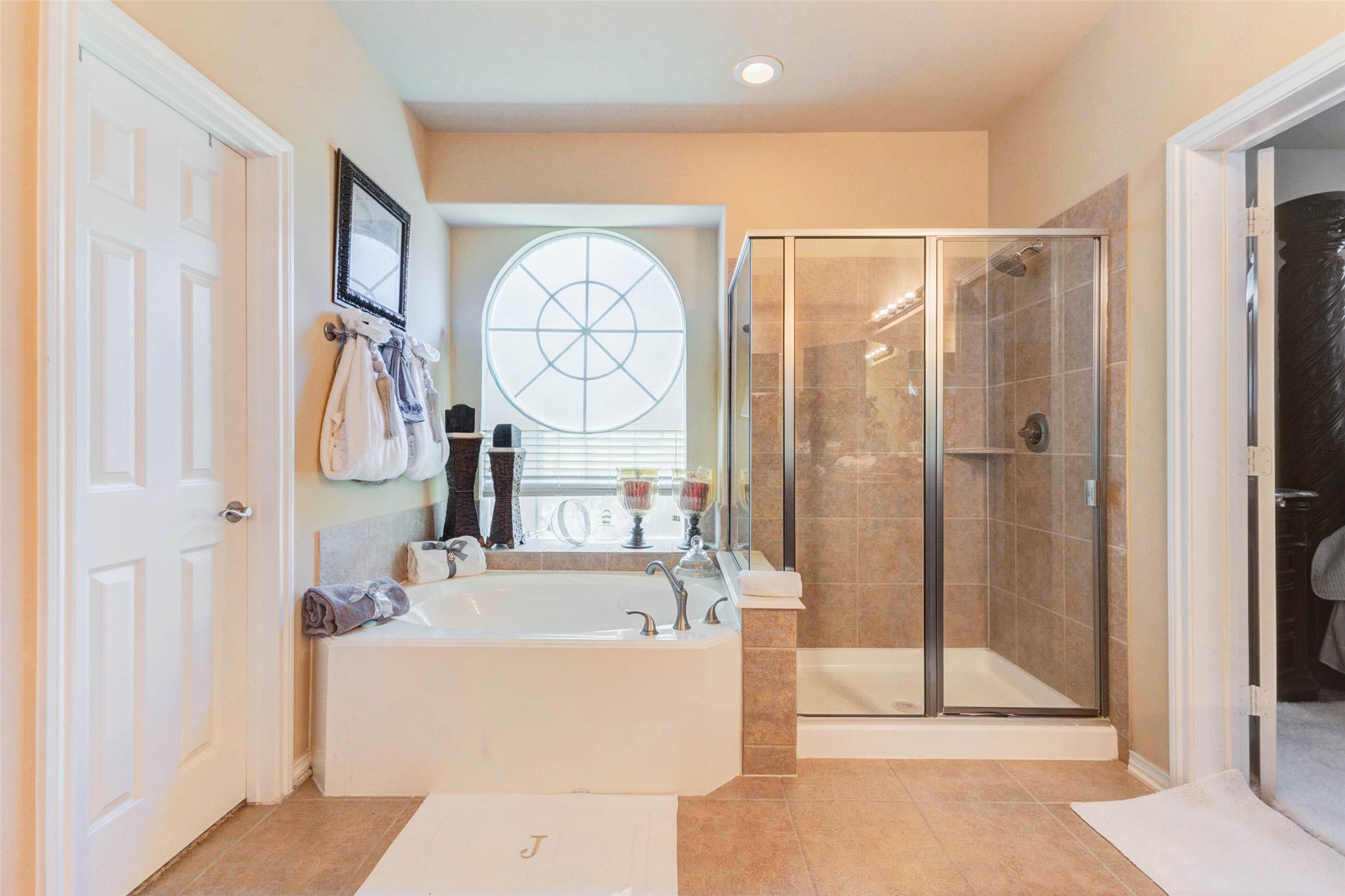 8211 Paddle Rock Lane Rosenberg, TX 77469 - Photo 31 of 50 a bathroom with a tub sink and mirror