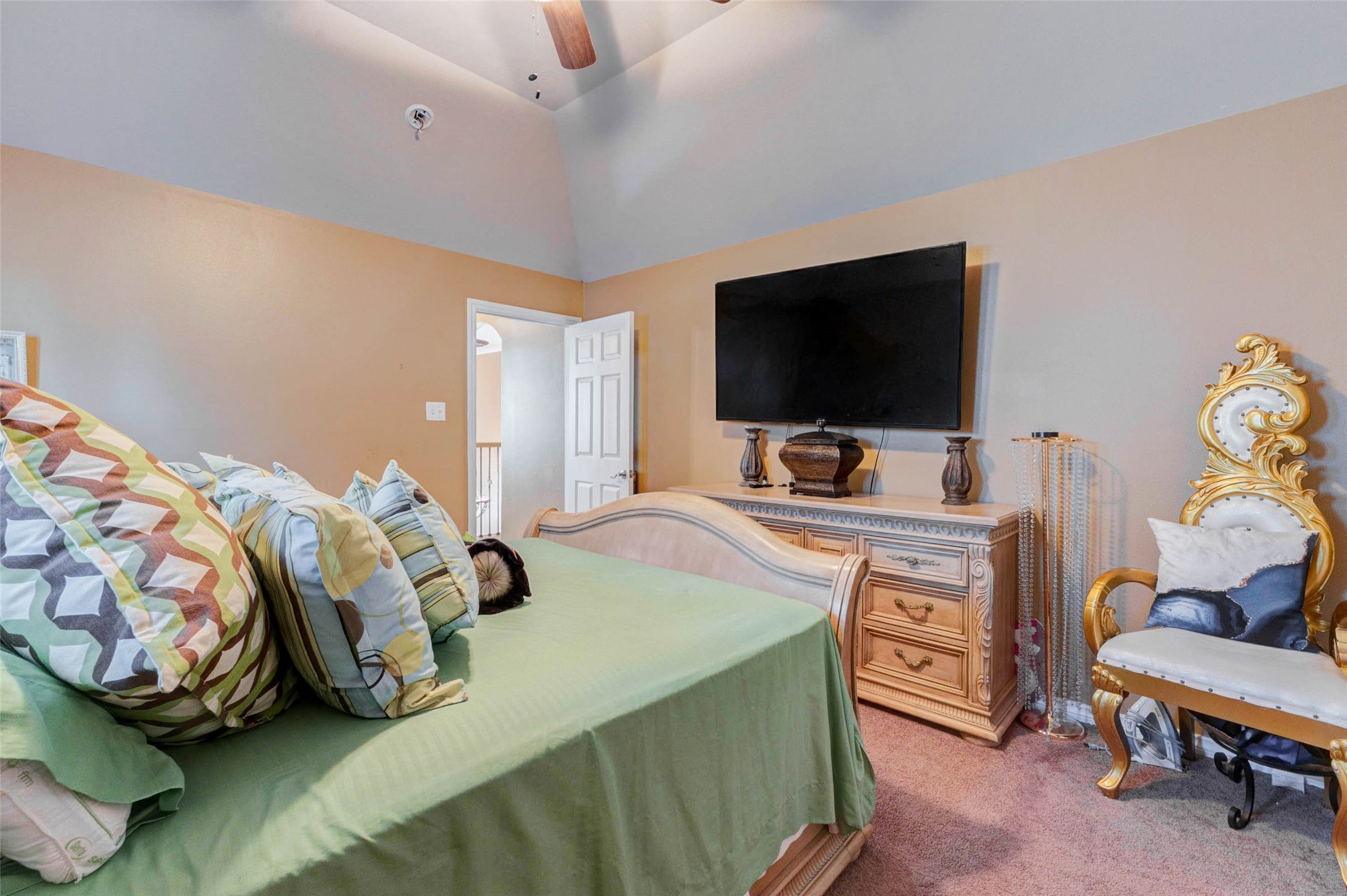 8211 Paddle Rock Lane Rosenberg, TX 77469 - Photo 35 of 50 a bedroom with bed and a flat screen tv