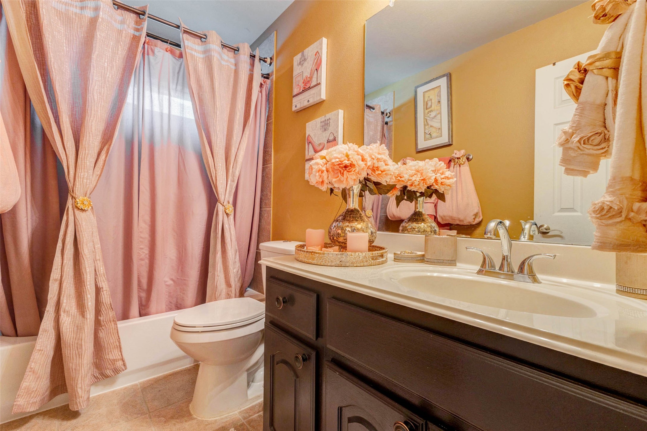 8211 Paddle Rock Lane Rosenberg, TX 77469 - Photo 37 of 50 a bathroom with a sink a toilet and a mirror