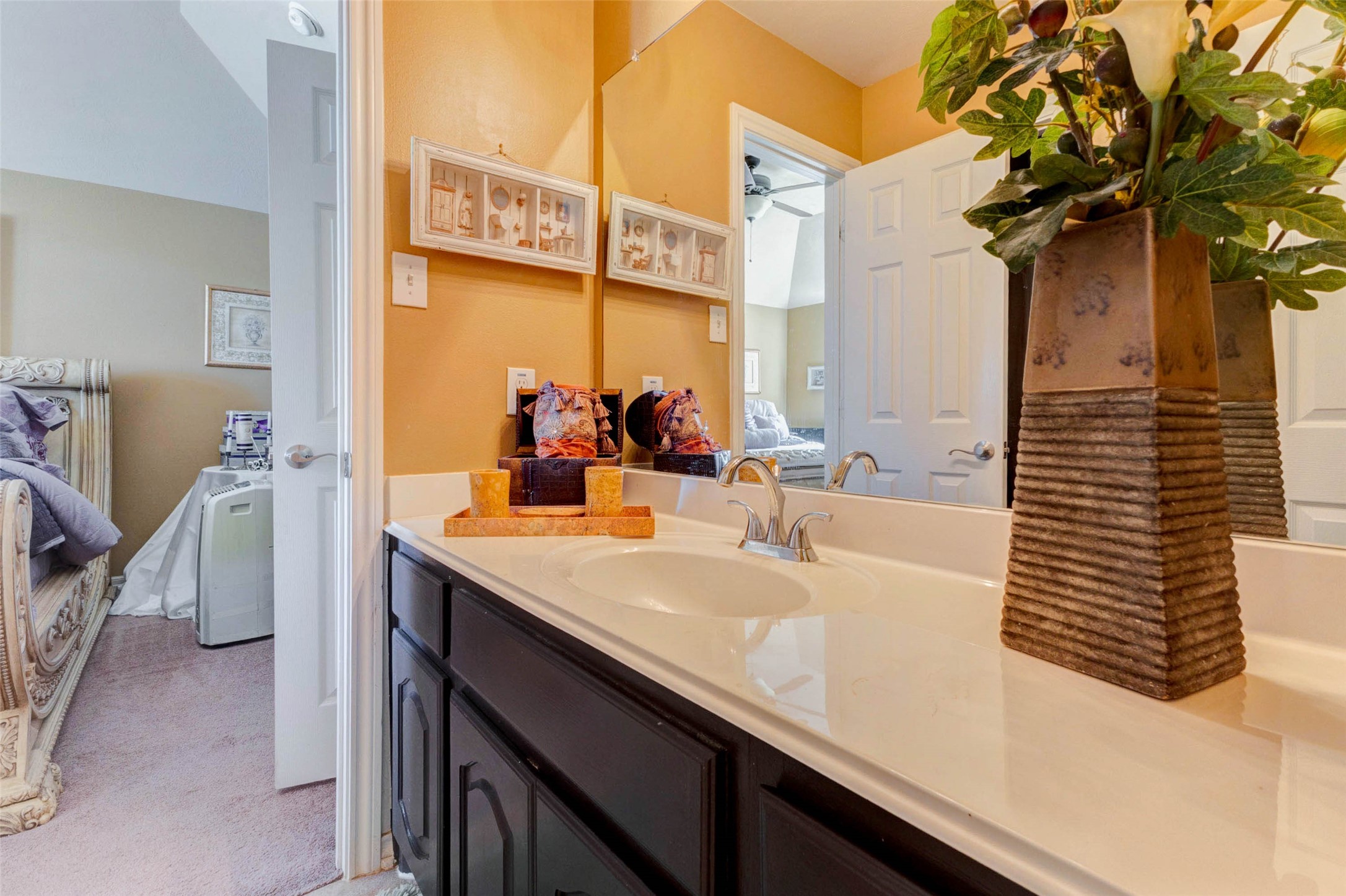 8211 Paddle Rock Lane Rosenberg, TX 77469 - Photo 41 of 50 a bathroom with a sink and a mirror
