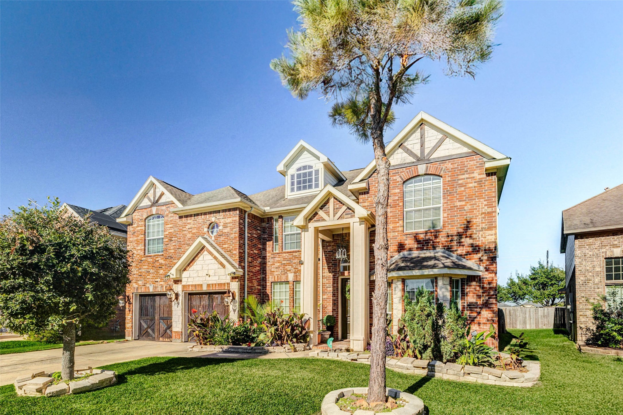 8211 Paddle Rock Lane Rosenberg, TX 77469 - Photo 49 of 50 a front view of a house with garden