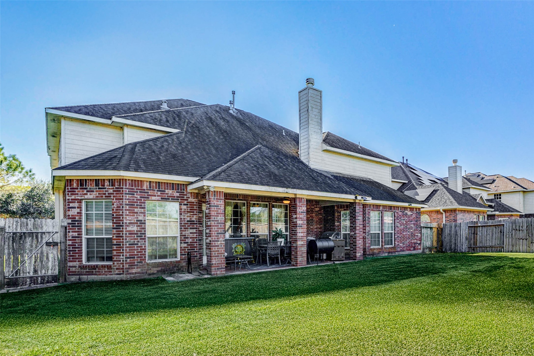 8211 Paddle Rock Lane Rosenberg, TX 77469 - Photo 50 of 50 a view of a big house with a big yard and large trees