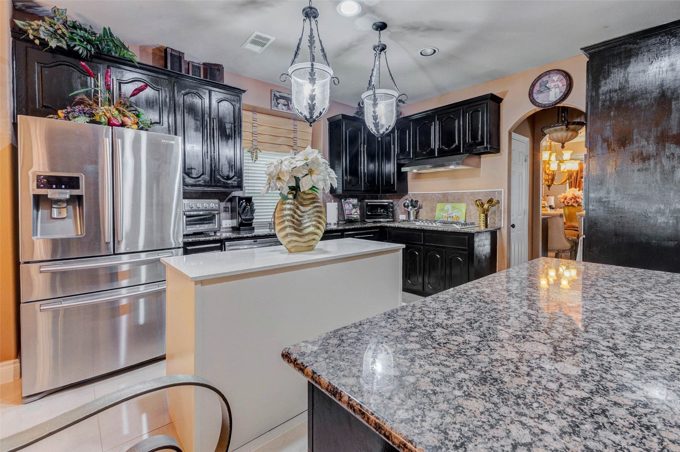 8211 Paddle Rock Lane Rosenberg, TX 77469 - Photo 5 of 50 a kitchen with refrigerator and cabinets