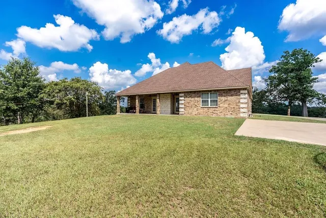 a view of a couches in patio with a garden