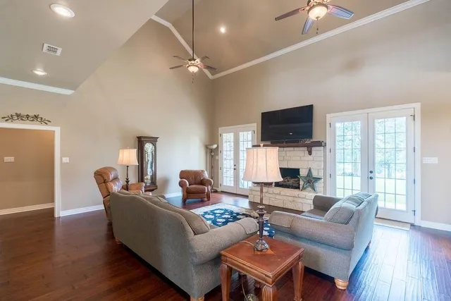a living room with furniture and a fireplace
