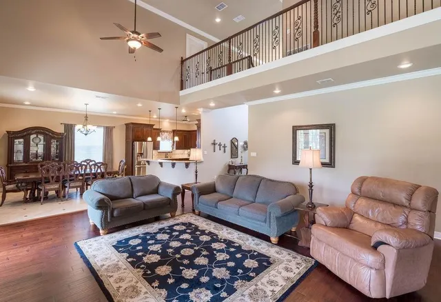 a living room with furniture and a rug