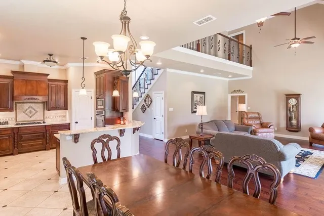 a kitchen with stainless steel appliances granite countertop a refrigerator sink and cabinets
