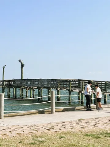 a view of a swimming pool with outdoor seating