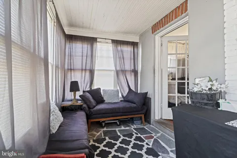 a living room with furniture and a rug