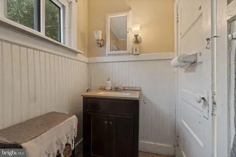 a bathroom with a shower curtain and a curtain