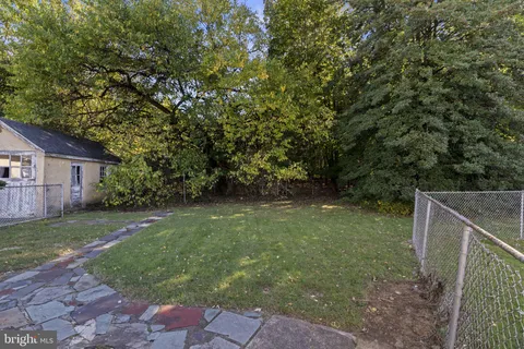 a view of backyard with green space