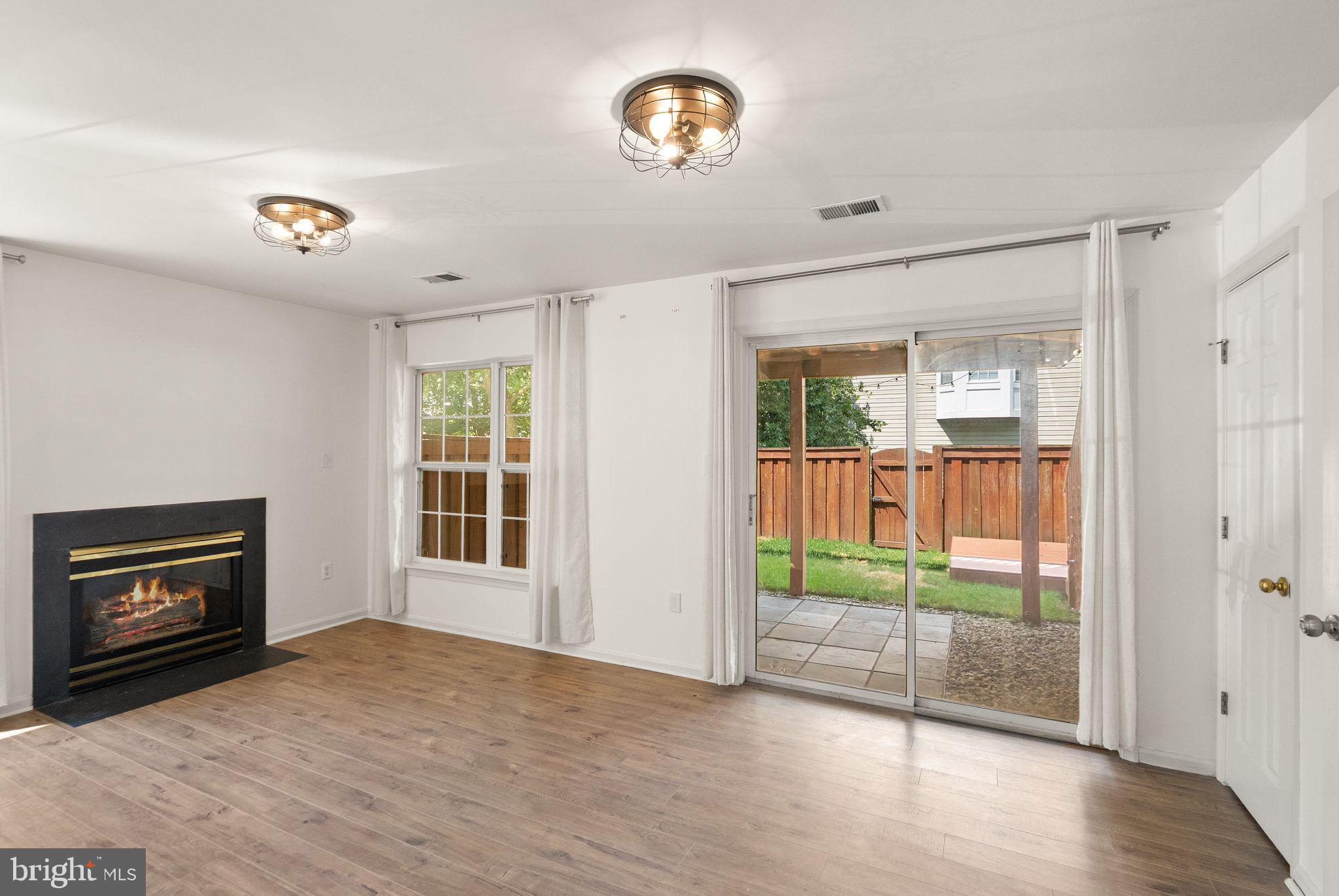 21659 Frame Square Broadlands, VA 20148 - Photo 11 of 68 a view of an empty room with wooden floor and a window