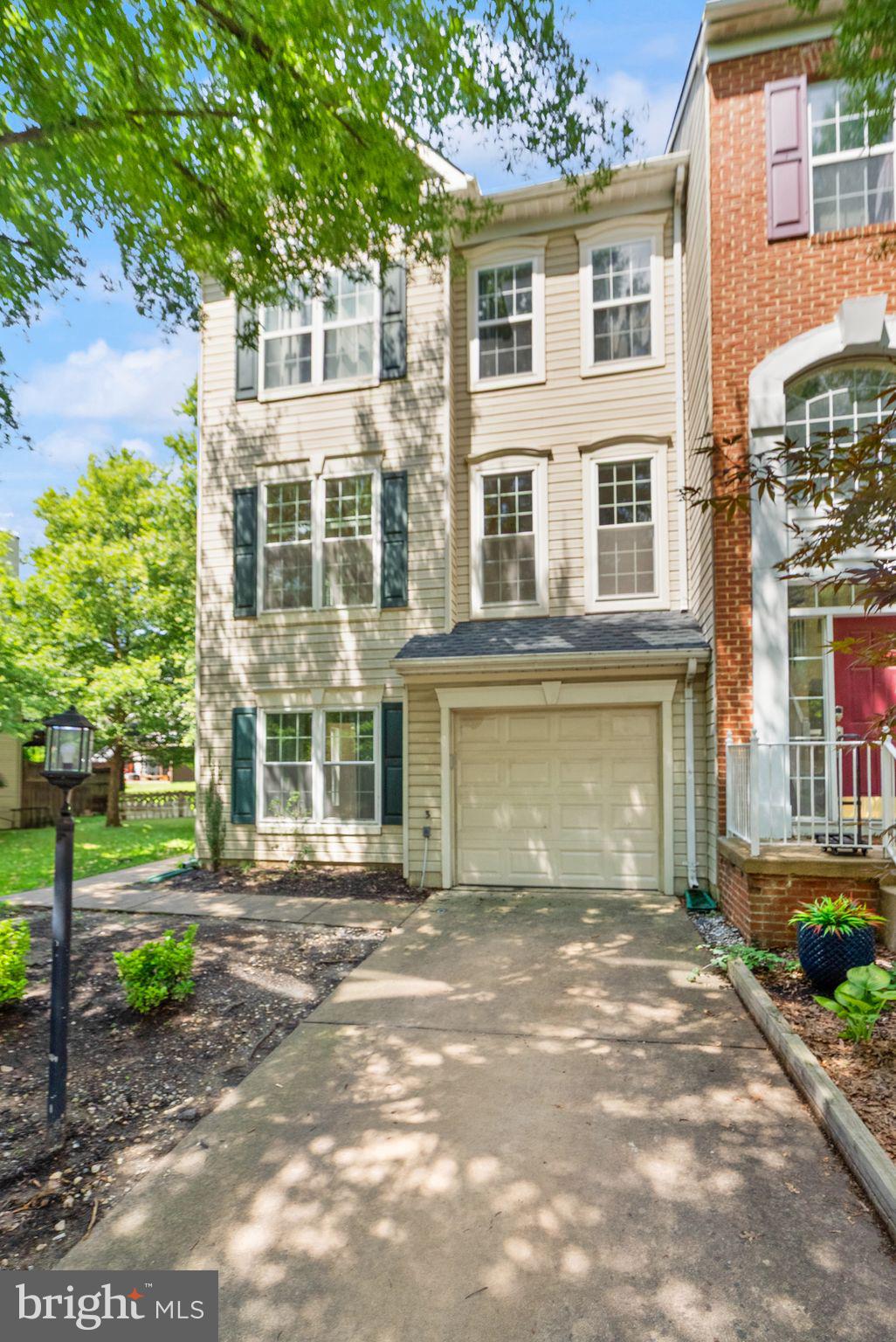 21659 Frame Square Broadlands, VA 20148 - Photo 2 of 68 a front view of a house with a garden