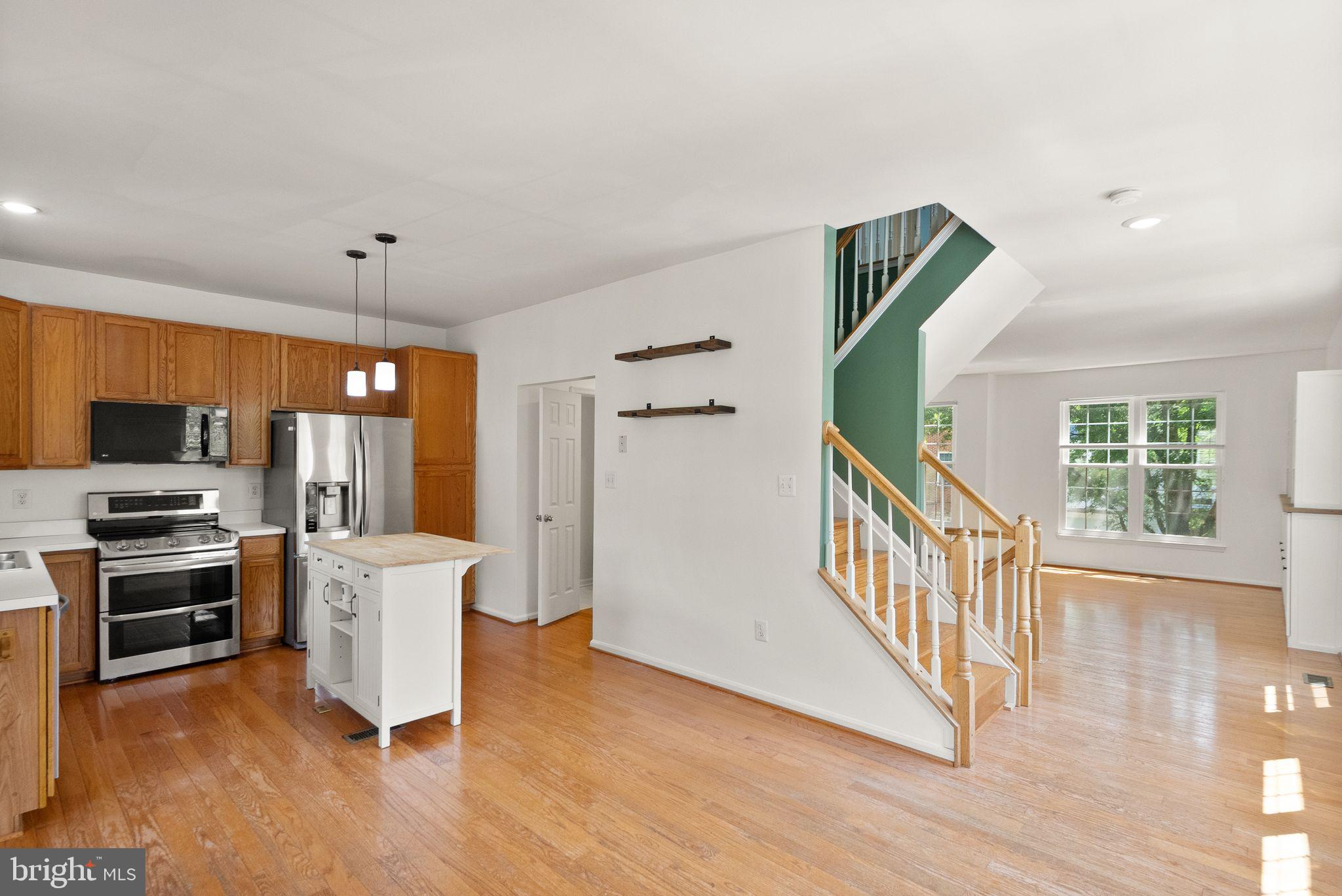 21659 Frame Square Broadlands, VA 20148 - Photo 22 of 68 a view of kitchen with furniture and wooden floor