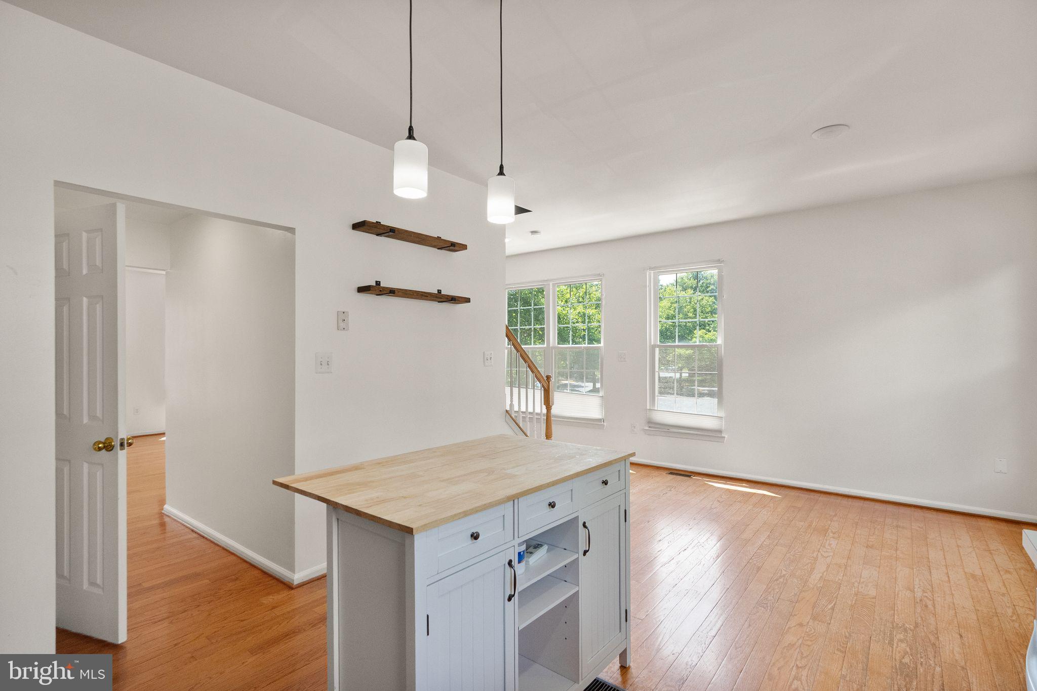 21659 Frame Square Broadlands, VA 20148 - Photo 24 of 68 a view of an empty room with a window and wooden floor