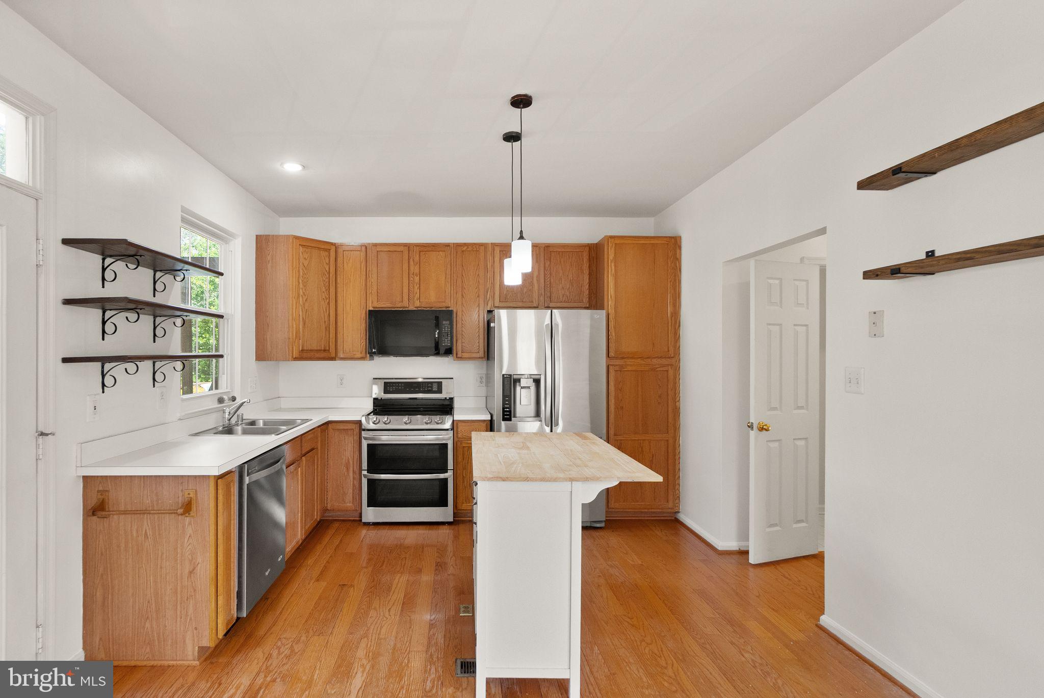 21659 Frame Square Broadlands, VA 20148 - Photo 25 of 68 a kitchen with cabinets a sink and stainless steel appliances