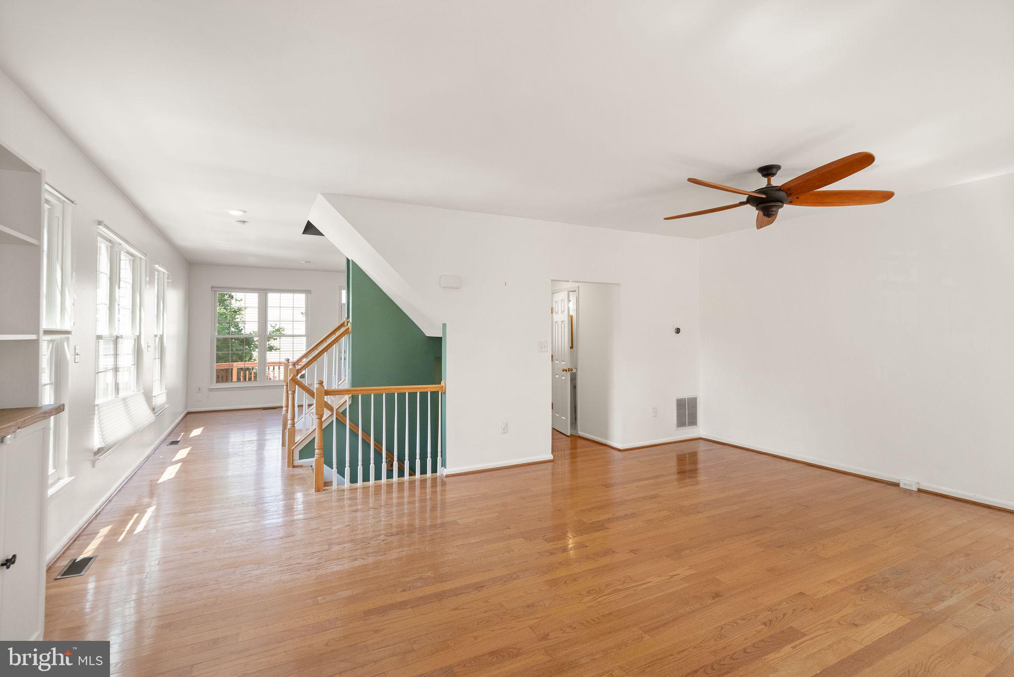 21659 Frame Square Broadlands, VA 20148 - Photo 29 of 68 a view of a livingroom with a ceiling fan and wooden floor