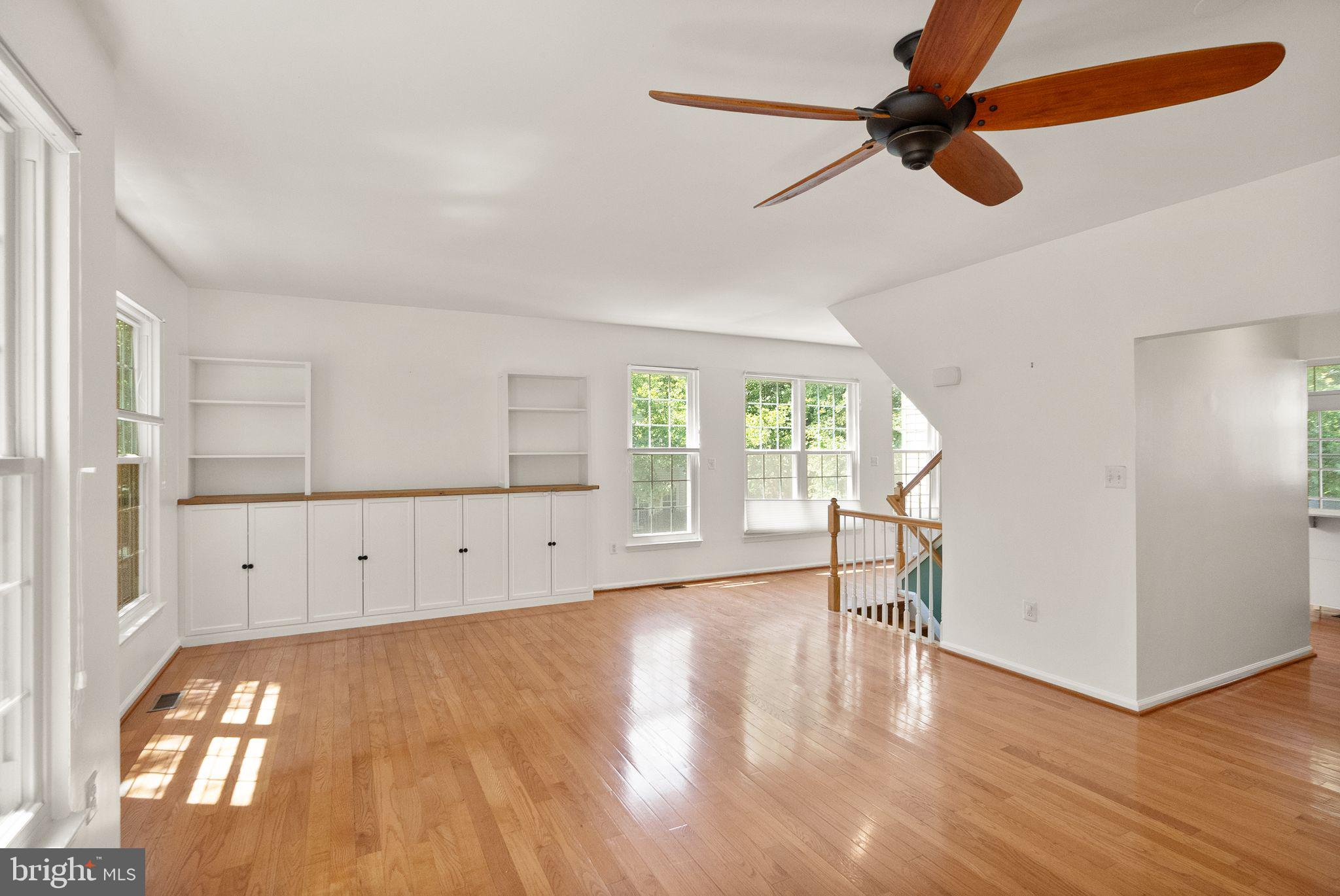 21659 Frame Square Broadlands, VA 20148 - Photo 30 of 68 an empty room with wooden floor cabinet and windows