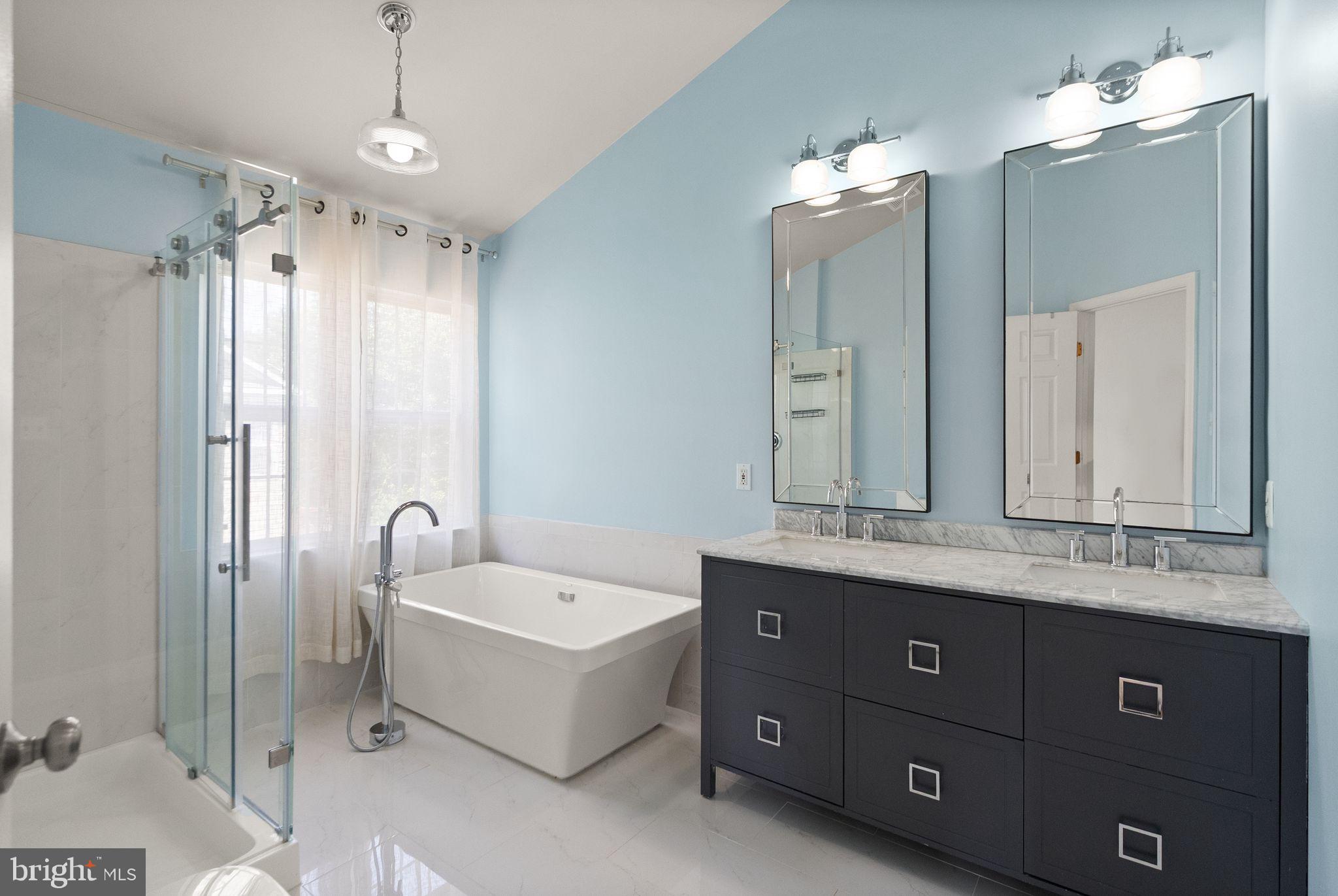 21659 Frame Square Broadlands, VA 20148 - Photo 43 of 68 a bathroom with a double vanity sink mirror and bathtub