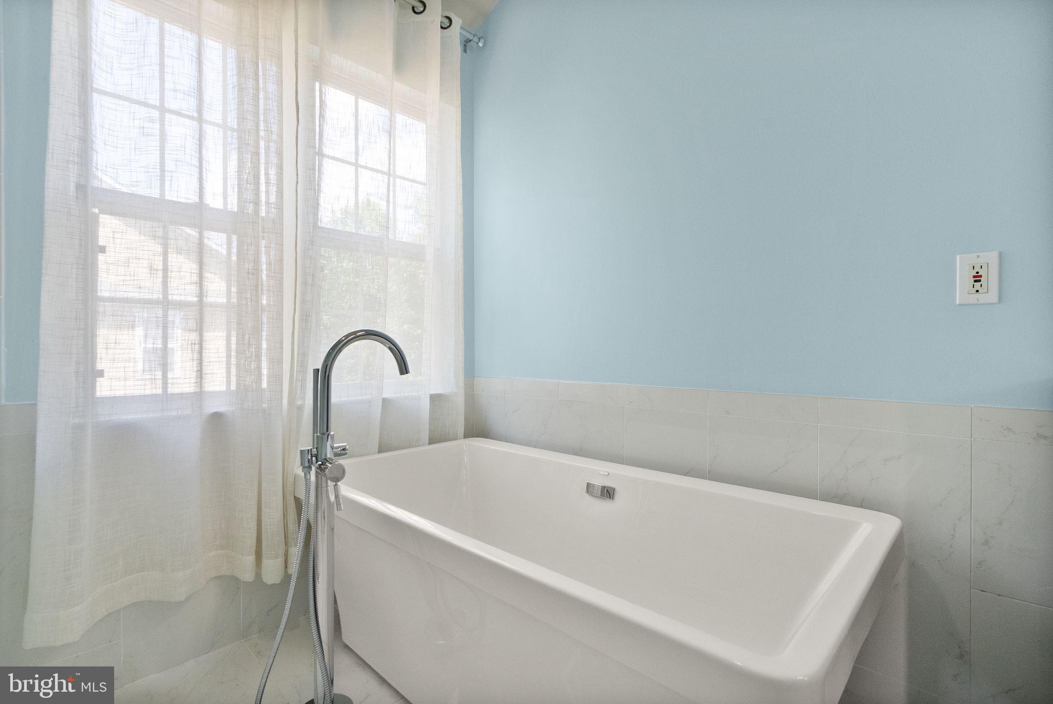 21659 Frame Square Broadlands, VA 20148 - Photo 44 of 68 a bathroom with bathtub