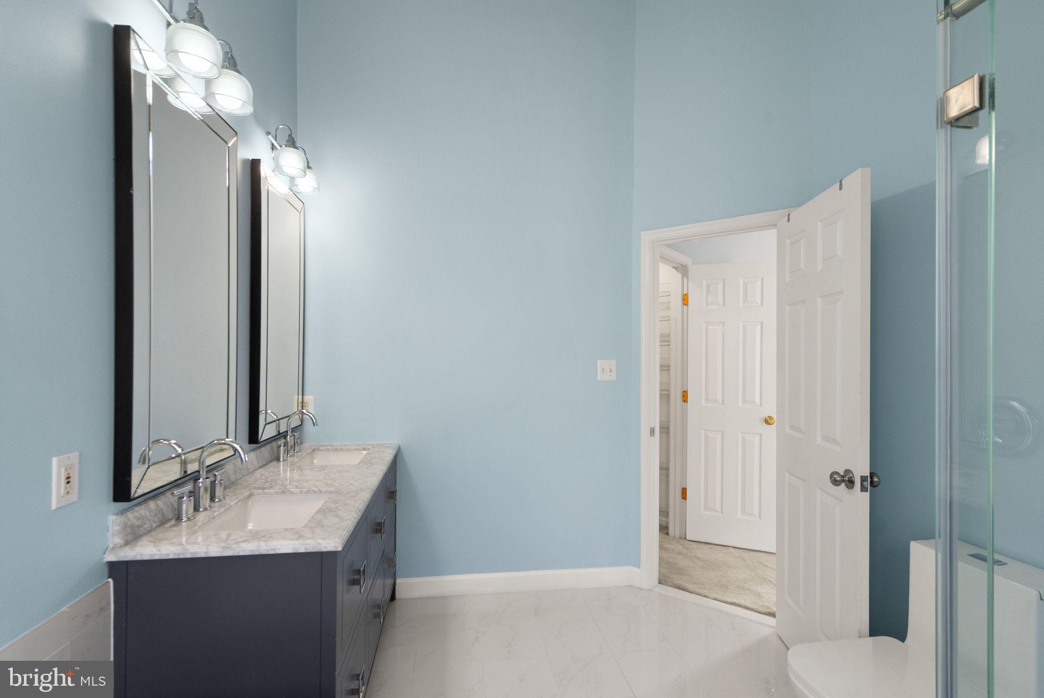 21659 Frame Square Broadlands, VA 20148 - Photo 45 of 68 a bathroom with a sink and a mirror