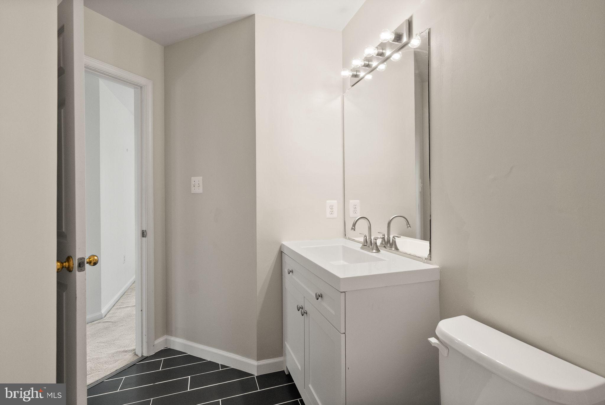 21659 Frame Square Broadlands, VA 20148 - Photo 52 of 68 a bathroom with a sink toilet and shower
