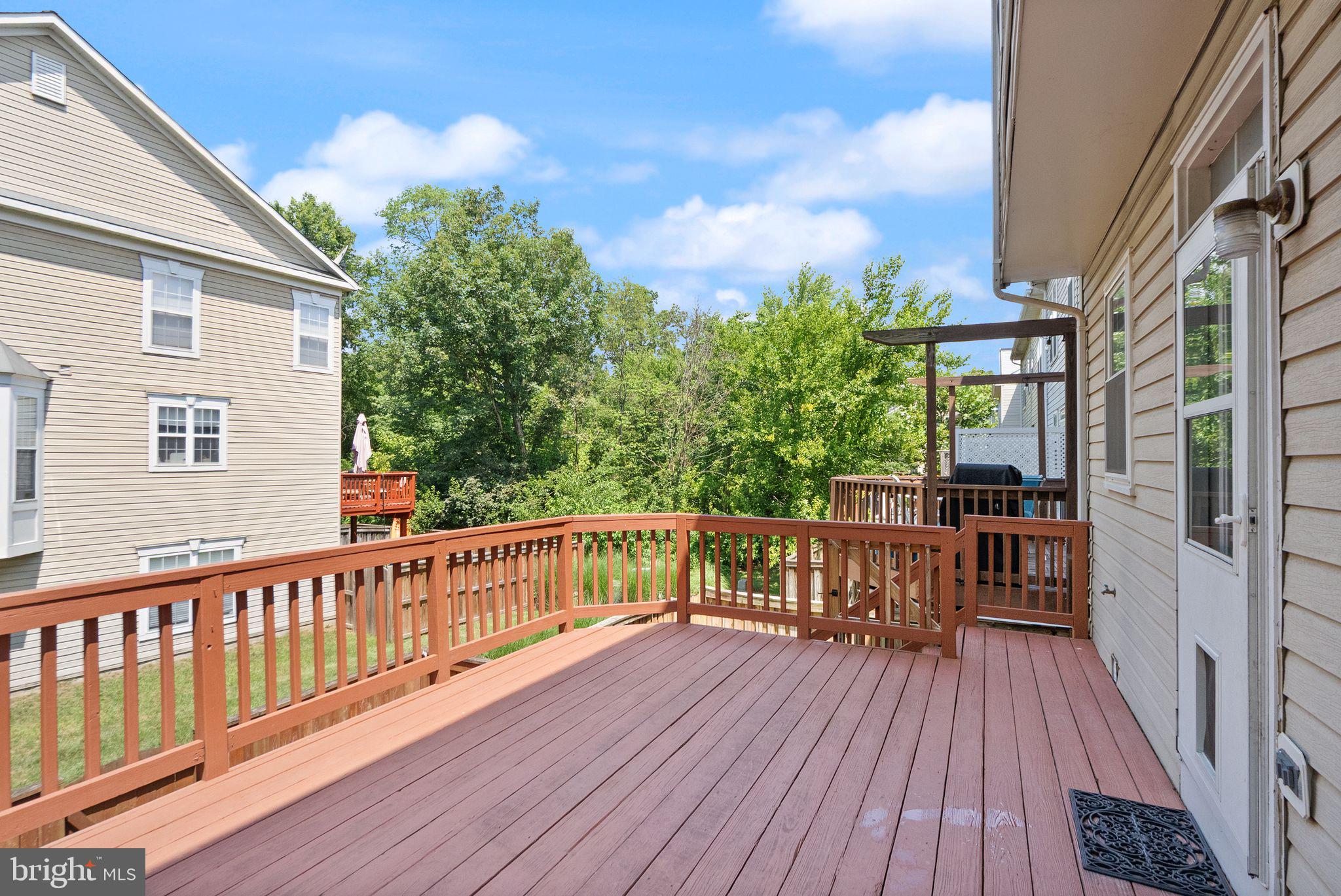 21659 Frame Square Broadlands, VA 20148 - Photo 53 of 68 a view of balcony with wooden floor and fence