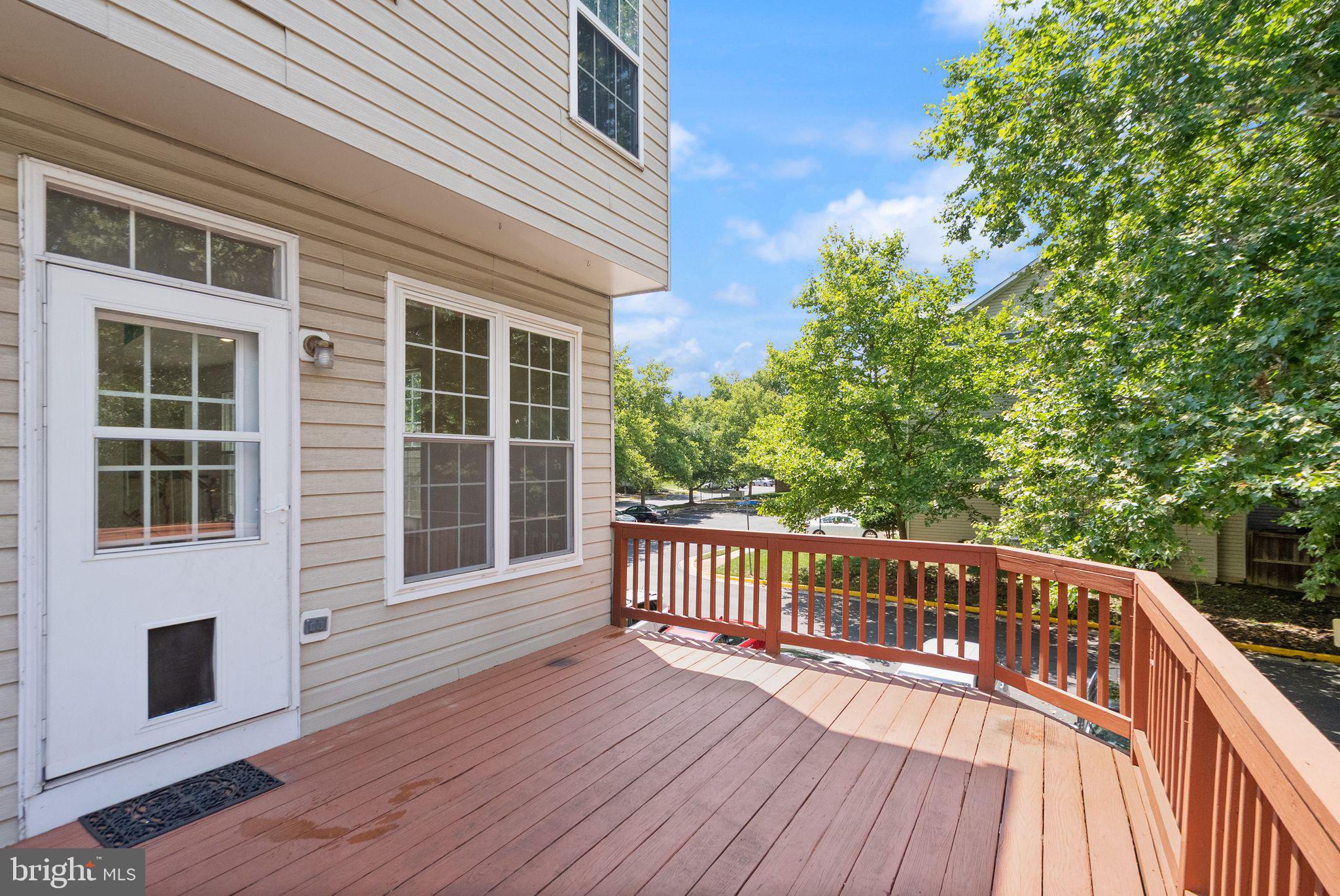 21659 Frame Square Broadlands, VA 20148 - Photo 54 of 68 a view of deck with a large window and wooden floor