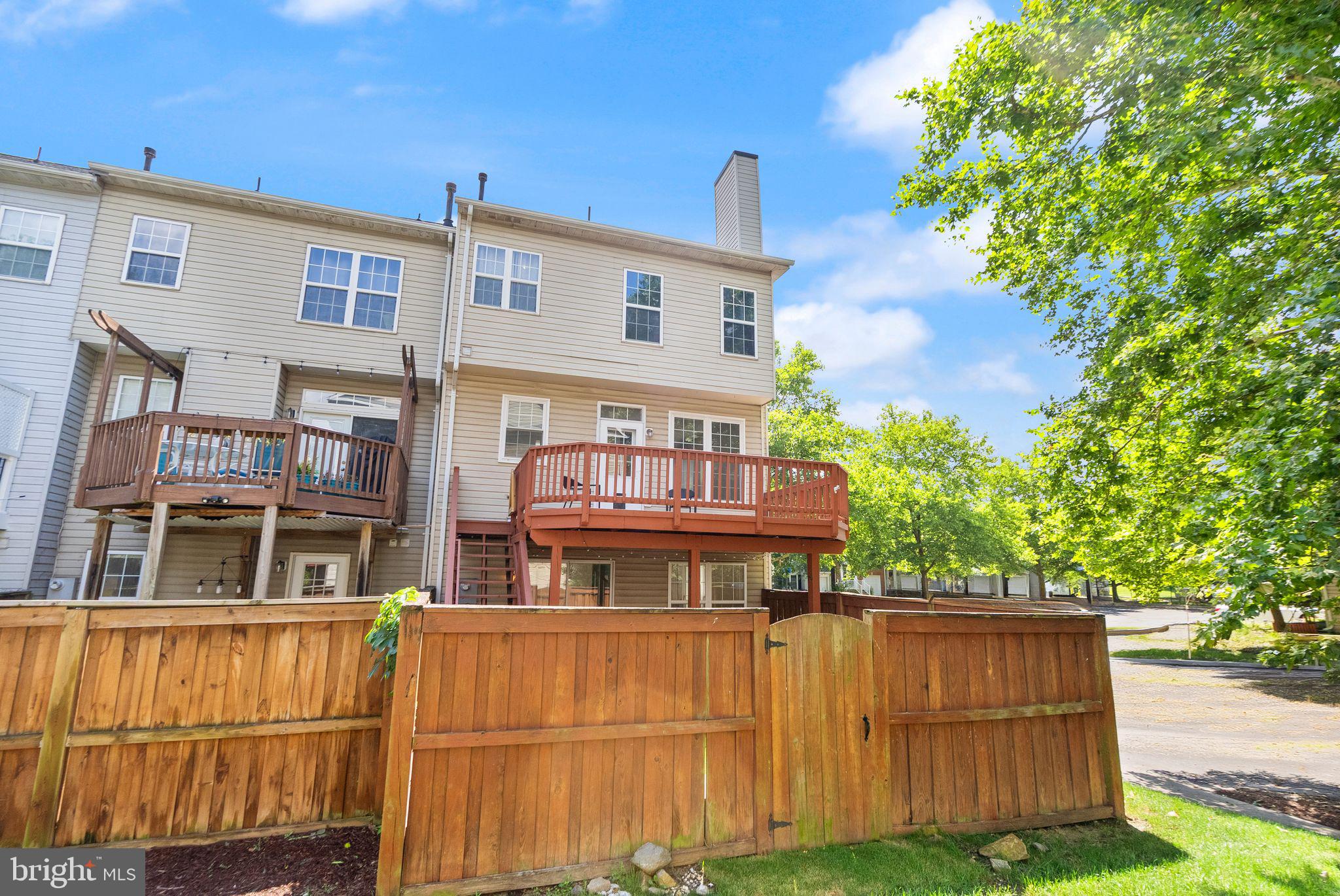 21659 Frame Square Broadlands, VA 20148 - Photo 63 of 68 a view of a brick building with a tree in front of it