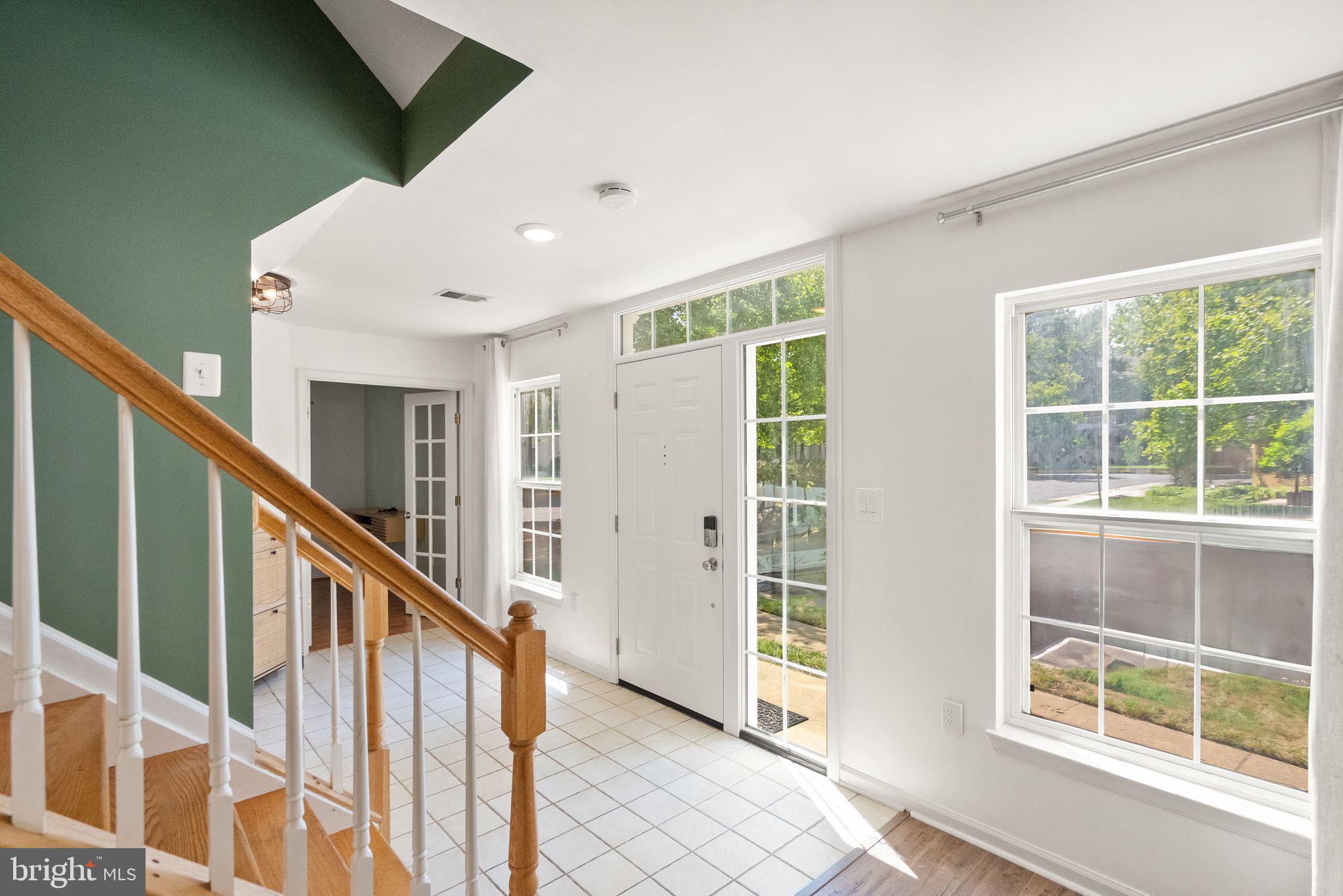 21659 Frame Square Broadlands, VA 20148 - Photo 7 of 68 a view of staircase with white walls and windows