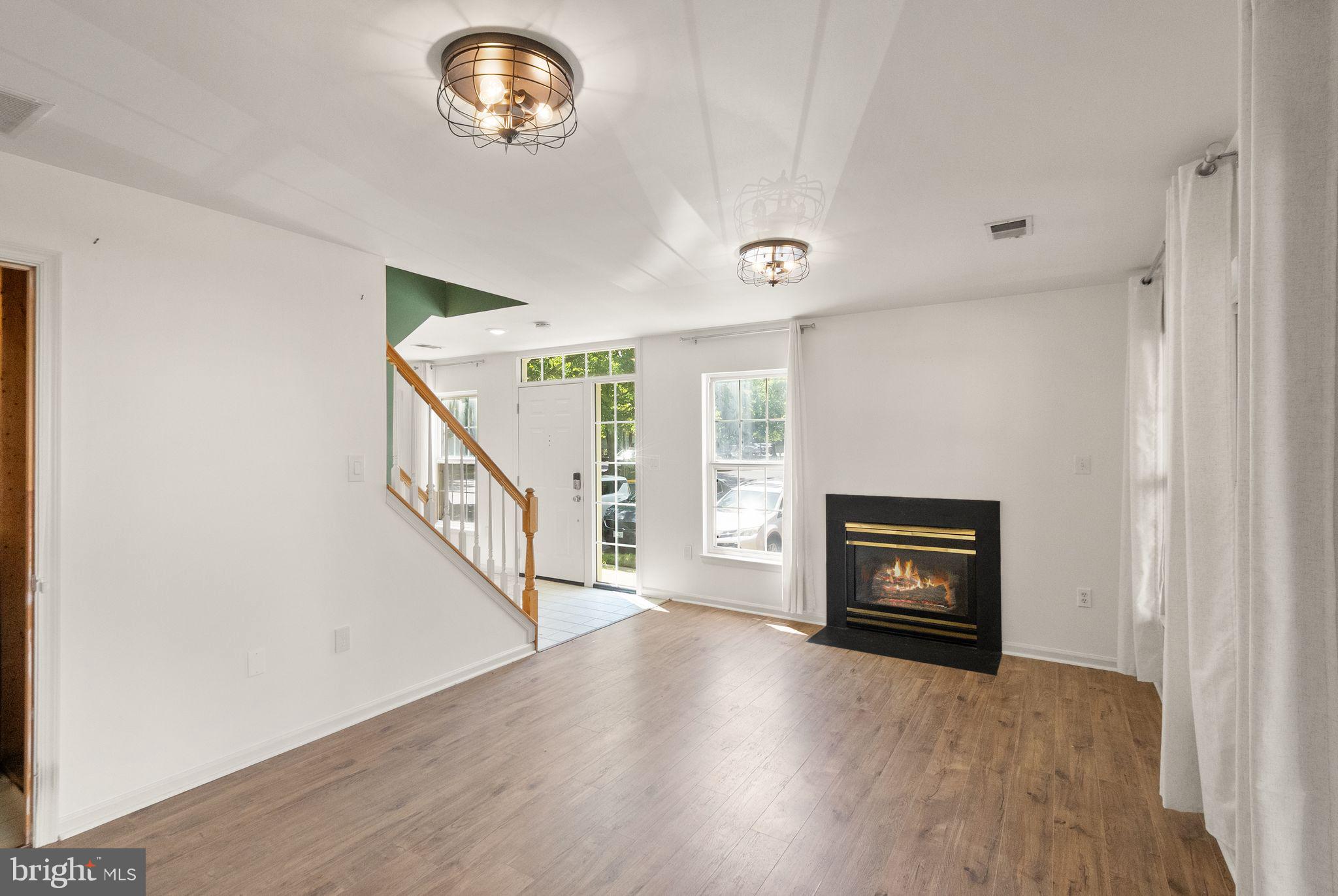 21659 Frame Square Broadlands, VA 20148 - Photo 9 of 68 a view of empty room with wooden floor and fan