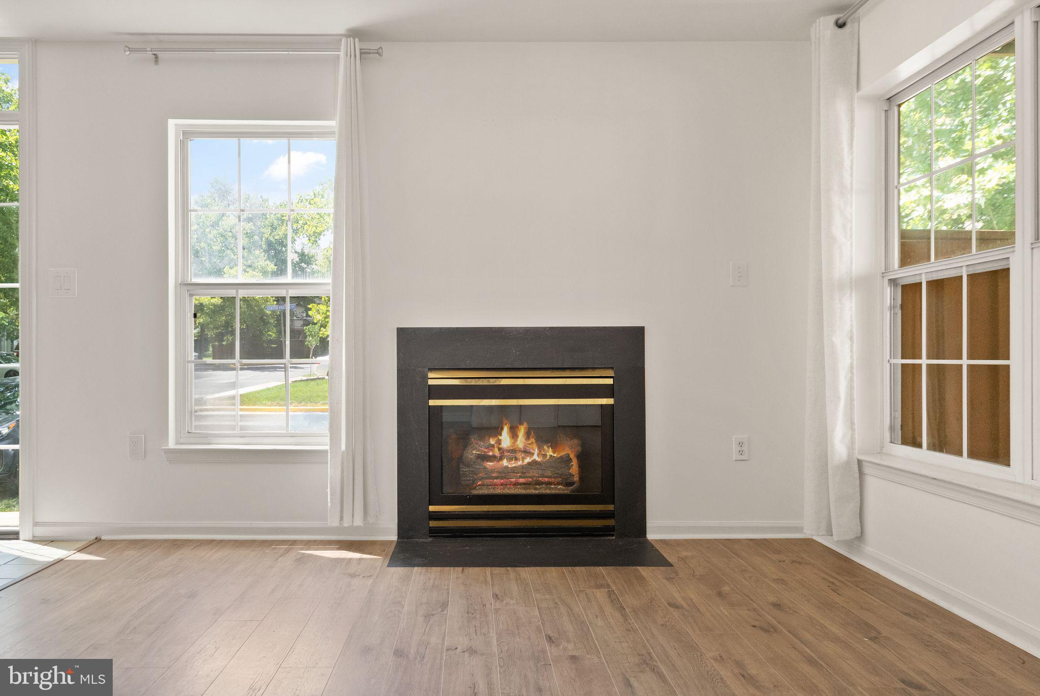 21659 Frame Square Broadlands, VA 20148 - Photo 10 of 68 a view of an empty room with wooden floor and a window