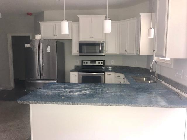 421 Kaiser Road Dickson, TN 37055 - Photo 4 of 19 a kitchen with stainless steel appliances granite countertop a sink a stove and a refrigerator