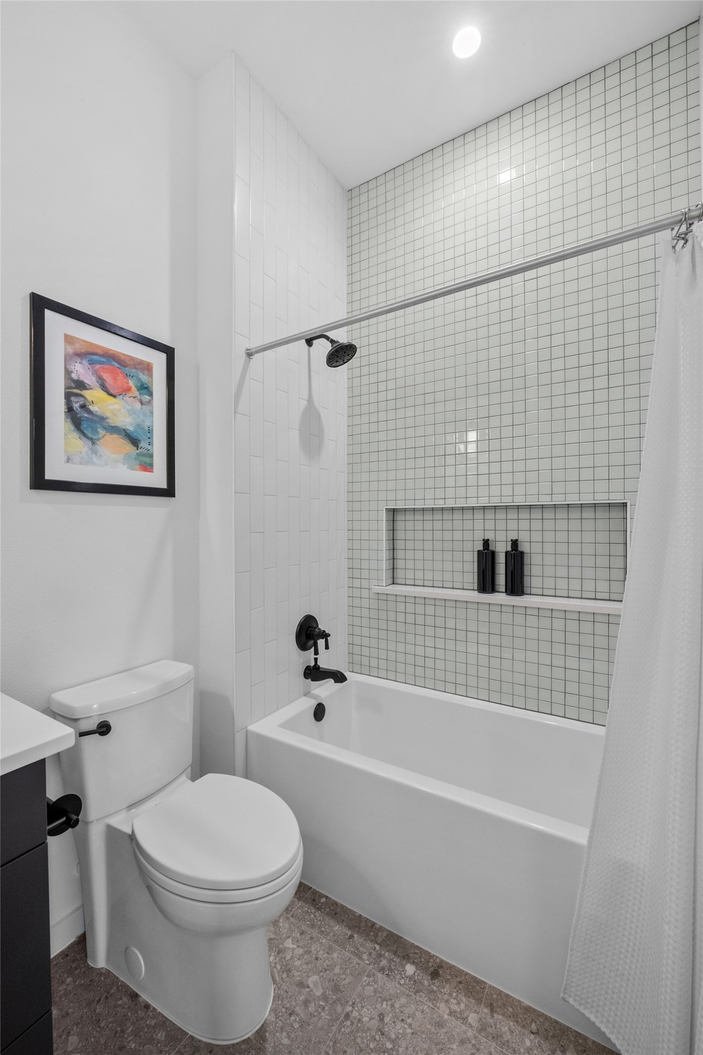 219 Lessin Lane, Unit 10A Austin, TX 78704 - Photo 16 of 28 a bathroom with a toilet and a bathtub