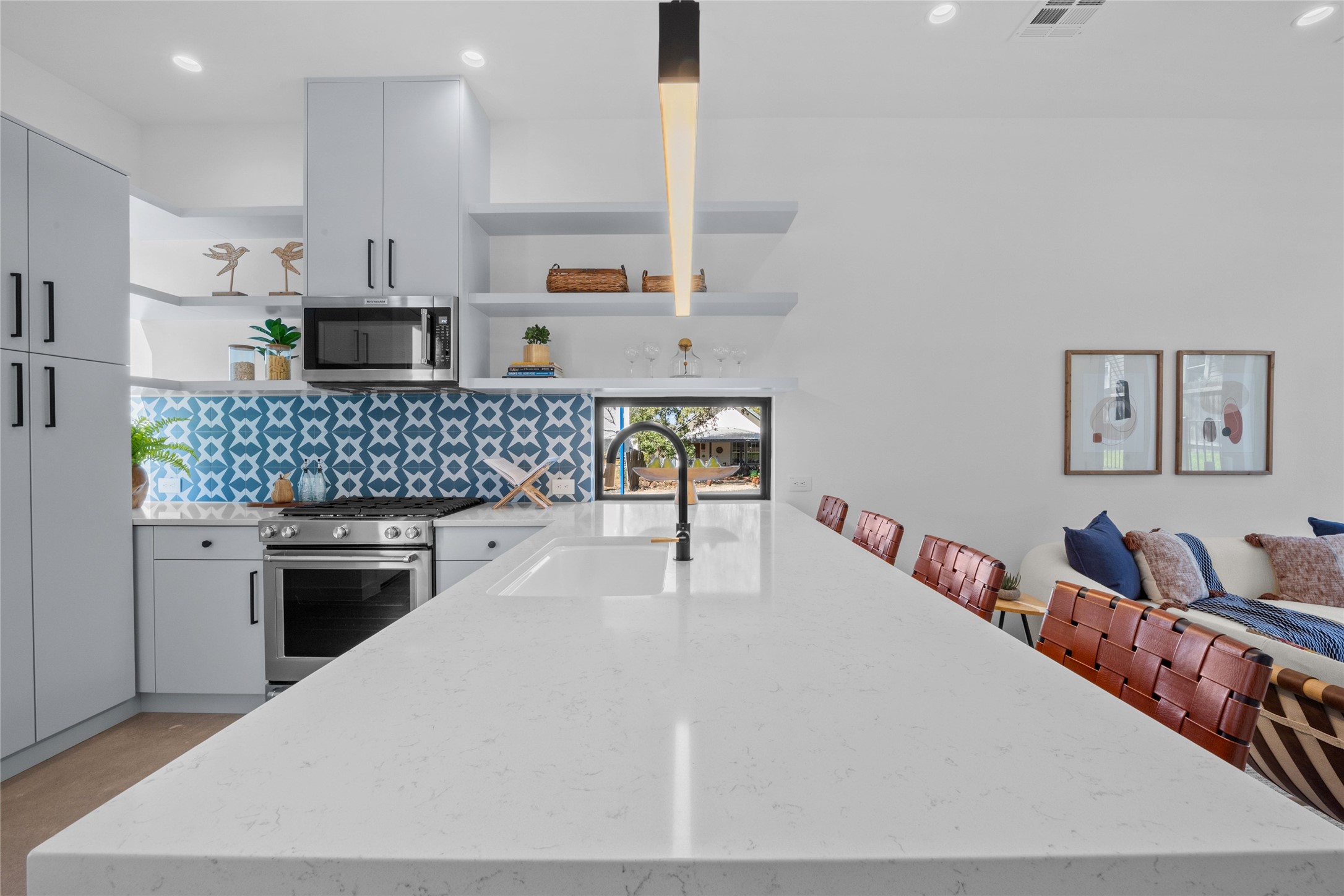 219 Lessin Lane, Unit 10A Austin, TX 78704 - Photo 2 of 28 a kitchen with stainless steel appliances kitchen island granite countertop a sink and cabinets