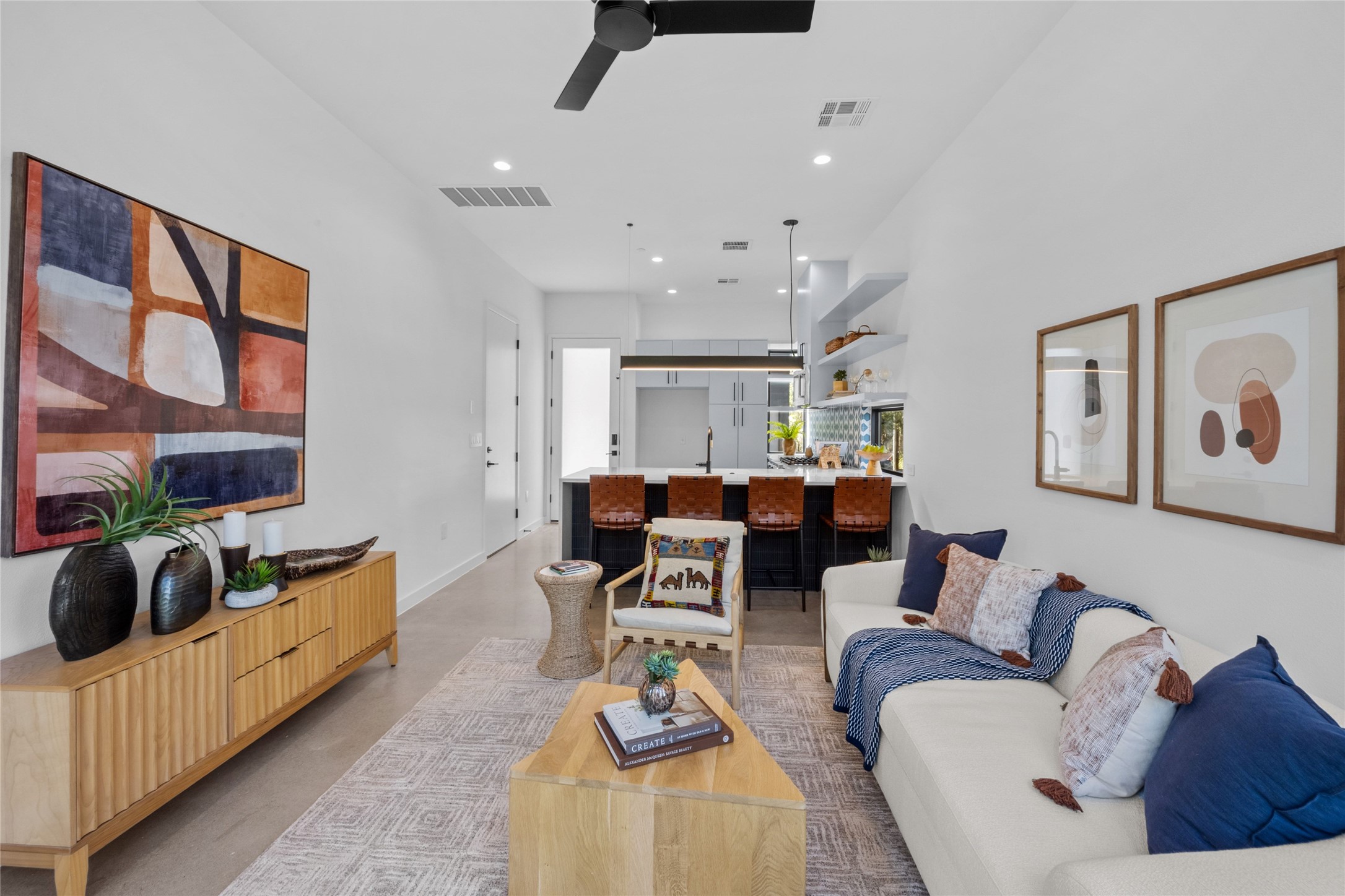 219 Lessin Lane, Unit 10A Austin, TX 78704 - Photo 7 of 28 a living room with furniture and a large window