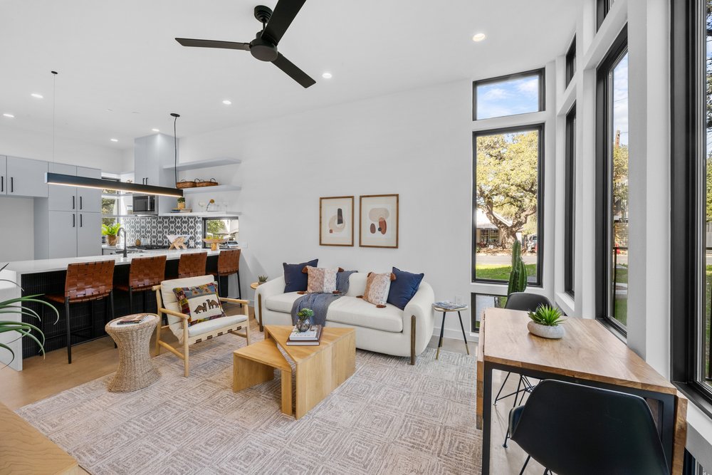 219 Lessin Lane, Unit 10A Austin, TX 78704 - Photo 8 of 28 a living room with lots of furniture and a window