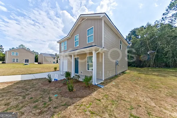 a view of a house with a yard