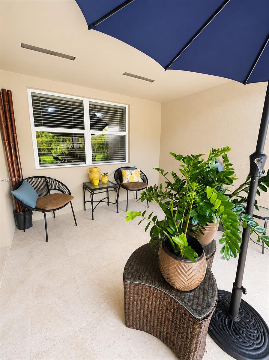 14856 Southwest 179th Street Miami, FL 33187 - Photo 31 of 33 a living room with furniture and a potted plant