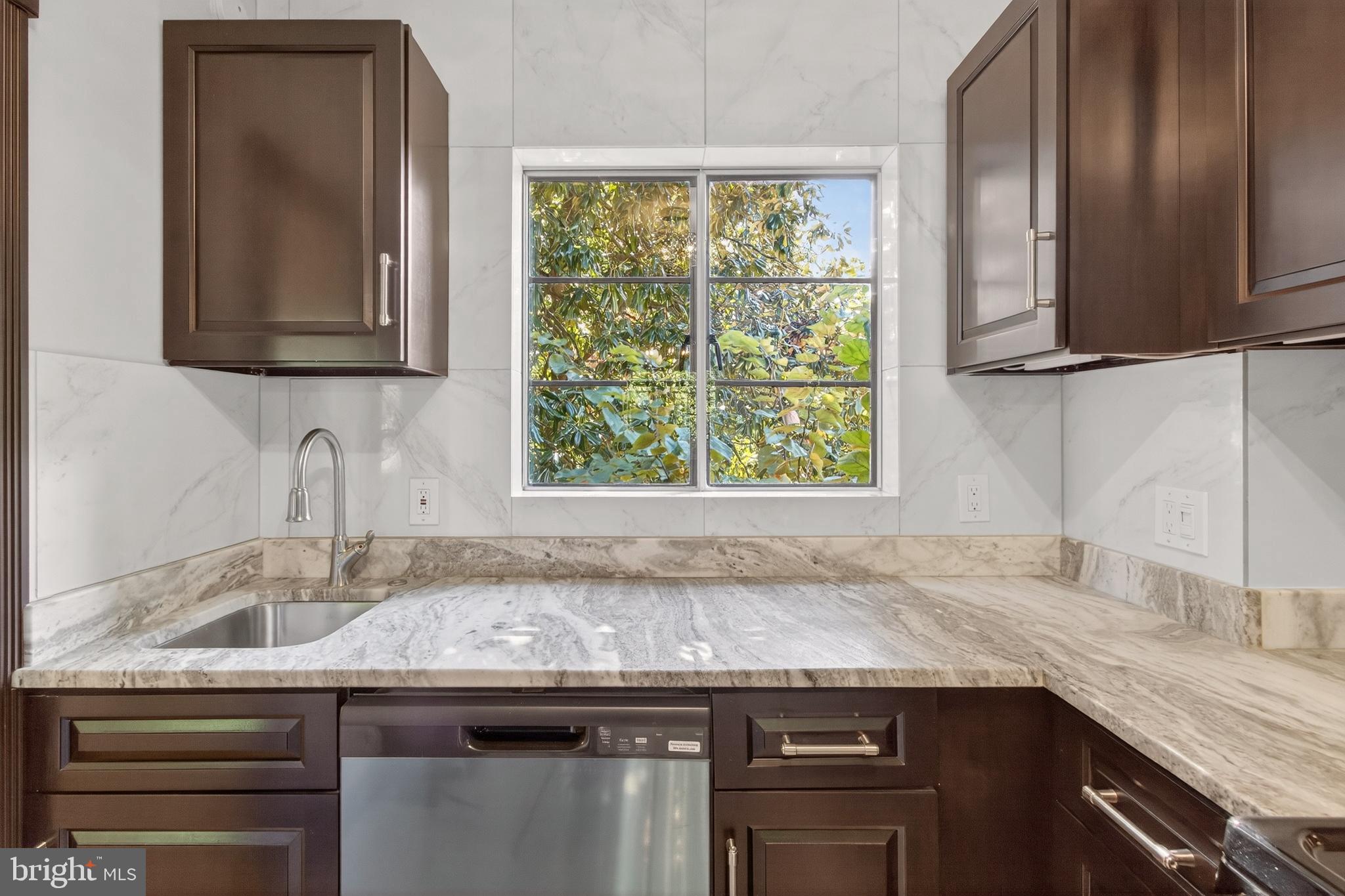 1649 Preston Road Alexandria, VA 22302 - Photo 12 of 31 a kitchen with granite countertop a sink and a window