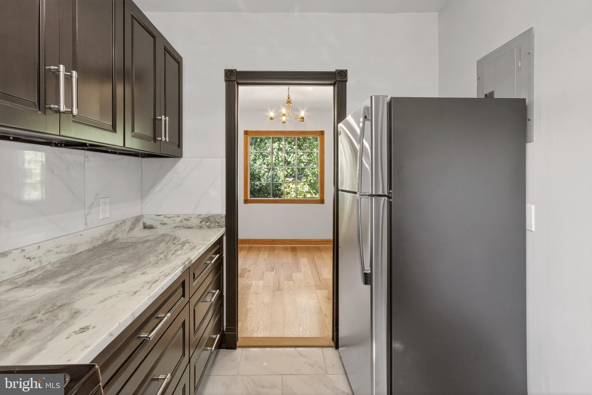 1649 Preston Road Alexandria, VA 22302 - Photo 13 of 31 a kitchen with stainless steel appliances granite countertop a refrigerator and a sink
