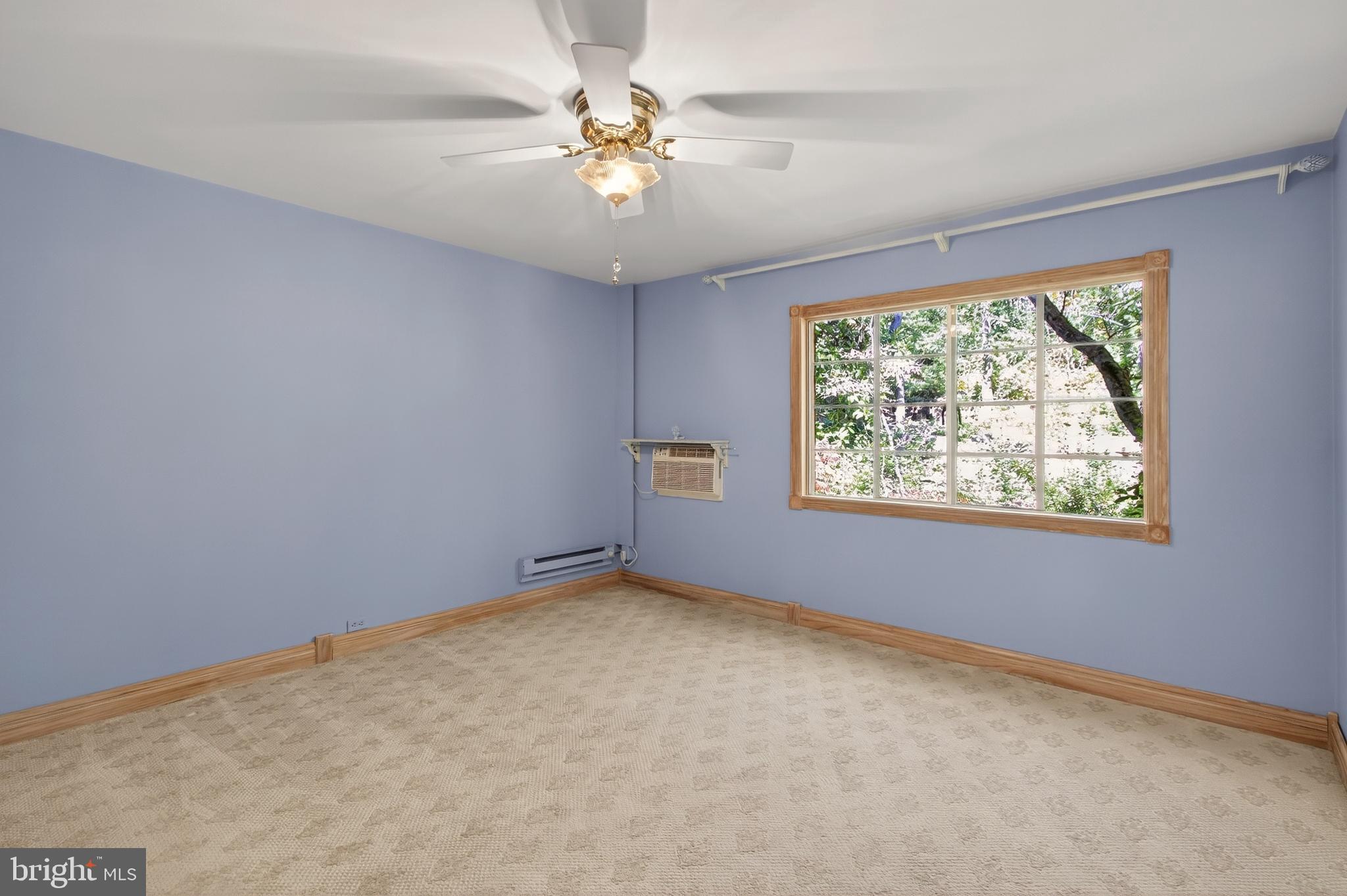 1649 Preston Road Alexandria, VA 22302 - Photo 15 of 31 an empty room with windows and ceiling fan